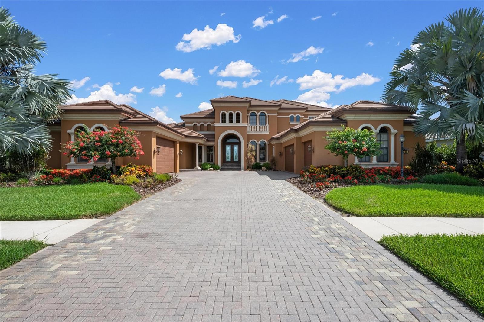 Custom Two-Story Riverfront Estate Situated on a 1.26-acre cul-de-sac lot with 103 feet of direct frontage on the Manatee River, this custom estate features 5,668 square feet of interior living space and an extensive list of structural and cosmetic upgrades. The exterior boasts a new roof installed in 2021, a 5-car garage, and a whole-house backup generator added in 2022. Waterfront amenities include a private, covered boat dock equipped with an electric boat lift, giving direct water access right from the backyard.
The fully remodeled gourmet kitchen features quartz countertops, premium solid wood cabinetry, and commercial-grade appliances including a built-in Sub-Zero refrigerator/freezer and a Viking range/oven system. The interior offers a central vacuum system, a wood-paneled elevator, fireplaces in nearly every room, and two tankless hot water heaters for seamless energy efficiency.
The primary level includes a completely reimagined primary bathroom. The traditional tub has been removed to make way for a slate stone walk-in shower that looks out toward a custom, illuminated stone waterfall feature. Additional living spaces include a grand stairway, a dedicated home theater room, and a second-level bonus room with a wet bar and pocket sliders opening to a wraparound balcony.
The outdoor entertainment oasis features a covered lanai, a summer kitchen, and an uncovered infinity-edge pool with an integrated spa. The entire pool area is accented by custom LED ambient lighting, which connects to a separate paved patio area featuring a built-in gas fire pit overlooking the river. Residents of Winding River also enjoy community access to a private boat ramp and nature preserve.