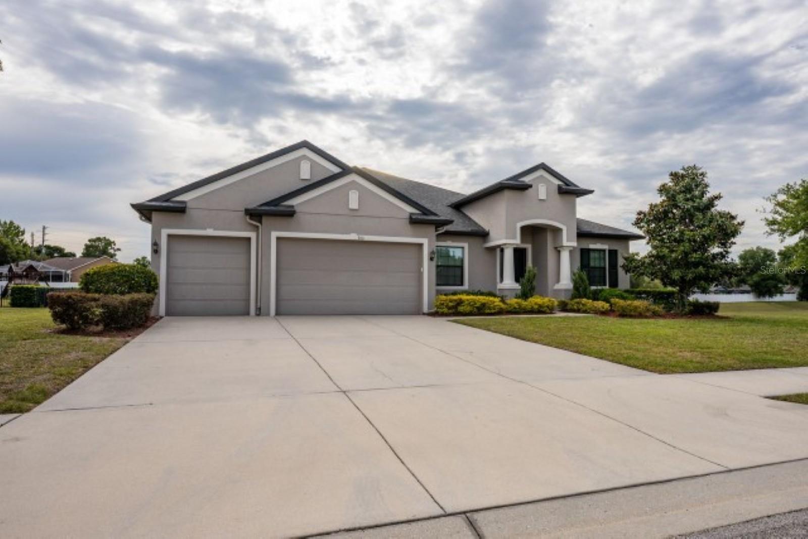 Are you ready to call this home sweet home? It is ready for you!
This massive five bedroom/ five-bathroomFrom the  mansion is ready for occupancy in the highly sought after gated community of Carlisle Place. The home sits on almost one acre with a fully fenced yard. Lawn and garden service included. As you enter the grand foyer, you are greeted with the formal dining area with feature wall. Moving through to the massive kitchen showcasing all stainless appliances with double oven, granite counters, breakfast bar, and separate workstation, this is an entertainer's delight. All bedrooms are conveniently located on the first floor. The master suite is fitted with dual vanities, over-sized walk-in shower and designer closet.
The loft area is a fabulous place to relax and play, have movie night, poker night or just to retreat. The built-in bar is custom lit with lots of shelving. The loft can be also used as a sixth bedroom as it contains a full bathroom and large armor. No detail left unfinished. Custom lighting, feature walls, auto-window coverings, LVT flooring throughout and finished garage floor are just a few highlights of this home. Washer and dryer are included. Pets welcome! Access to all community amenities.
Call today for your private showing of this spectacular home.