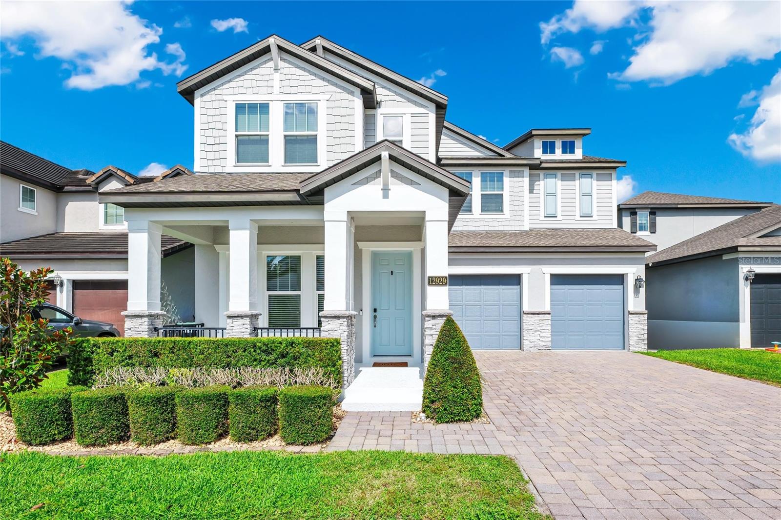 Virtually Staged. Enjoy the best of Central Florida living in a highly sought-after neighborhood, just minutes from local schools, shopping, great restaurants, and magic of Disney. This 5-bedroom, 4.5-bathroom pool home is clean, well-maintained, and ready for move-in, featuring a freshly painted interior along with a newly painted exterior stucco, patio, and doors.
THE FIRST FLOOR Walking in from the two-car garage and paver driveway, the covered front porch opens into a bright floorplan with high ceilings and tile floors. Right off the entrance is a formal sitting room that works perfectly as a quiet reading nook or music space. Down the hall, there's a convenient half-bath and a coat closet, leading into a large formal dining room made for family dinners.
The kitchen connects right to the family room and comes with a large island and breakfast bar, plenty of counter and cabinet space, a big pantry, stainless steel appliances, recessed lighting, and a hidden back scullery. Tucked away at the back of the main floor is a guest bedroom and full bath, which is great for a mother-in-law suite or a playroom.
THE SECOND FLOOR Upstairs, a large loft gives you a flexible second living area or media space. The laundry room is also on this level, making laundry a lot easier. The primary suite is set apart for privacy and includes separate individual vanities, a soaking tub, a glass shower, and a walk-in closet big enough to be a small room on its own. On the left side of the house, bedrooms 3 and 4 share a Jack-and-Jill bathroom. Across the way, bedroom 5 sits directly next to the home's fourth full bath.
OUTDOOR LIVING Out back, the home looks out over a quiet pond. The covered, screened patio leads to a heated pool, giving you a great spot to hang out during the day and watch the nightly Disney fireworks from your own backyard