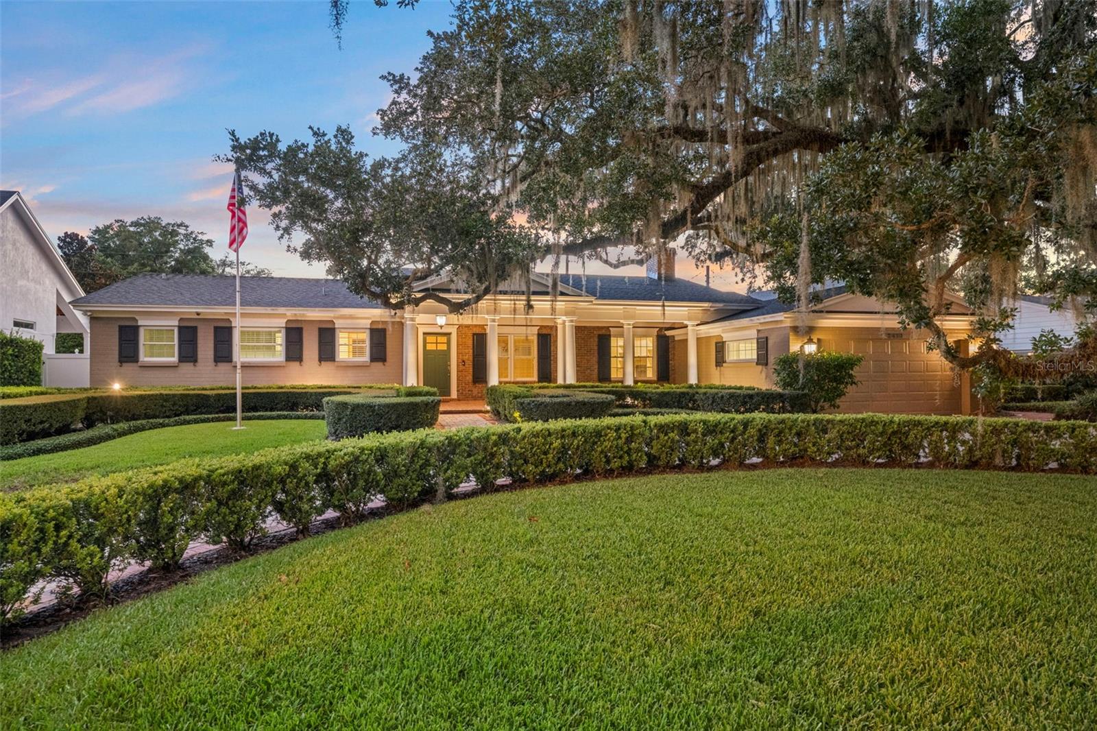 Nestled beneath majestic live oak trees on picturesque Lake Shore Drive in the highly sought-after Rose Isle neighborhood, this beautifully updated traditional home seamlessly blends timeless charm with modern luxury. Originally built in 1959 and completely renovated in 2011, the home features all-new electrical, plumbing, HVAC systems, and roof, offering peace of mind for years to come.
Inside, expansive living spaces showcase original heart pine hardwood floors and flow effortlessly from room to room, creating an ideal layout for both everyday living and entertaining. The chef's kitchen is a true centerpiece, featuring Wolf double ovens, a Wolf gas cooktop, Sub-Zero refrigerator, Bosch dishwasher, extensive custom cabinetry, abundant drawer storage, and built-in bookshelves framed by custom cabinetry for displaying your favorite cookbooks. A second sink adds extra convenience for meal prep and entertaining.
The spacious primary suite offers a lighted tray ceiling, a cozy sitting area, and an oversized walk-in closet with separate his-and-her sides. The secondary bedroom wing includes a generously sized en-suite bedroom—originally the home's primary suite—along with two additional bedrooms and a well-appointed hall bath.
Designed for entertaining, the expansive bonus room opens directly to the pool and features a custom handcrafted pub complete with a Summit beverage refrigerator, Summit dual-tap kegerator, accent lighting for a pub table, and dedicated lighting over the pool table. Just beyond the oversized laundry room is a versatile flex space ideal as a home office, game room, fitness room, or hobby space.
Step outside to your own private backyard retreat, where a sparkling swimming pool is surrounded by lush landscaping and generous yard space perfect for outdoor entertaining, barbecues, and family gatherings.
Additional features include an LP gas tank that services the clothes dryer, two tankless water heaters, the kitchen cooktop, outdoor grill connection, and both fireplaces located in the living room and kitchen. Natural gas service is also available through TECO Peoples Gas for future conversion if desired.
Located within the highly regarded Audubon Park K-8 and Winter Park High School districts, this exceptional home offers an unbeatable lifestyle just minutes from downtown Orlando, Park Avenue, The Fresh Market, Trader Joe's, and Interstate 4. Residents also enjoy convenient access to Loch Haven Park, the Orlando Science Center, AdventHealth Orlando, museums, gardens, and Orlando's scenic Urban Trail for walking, running, and biking.