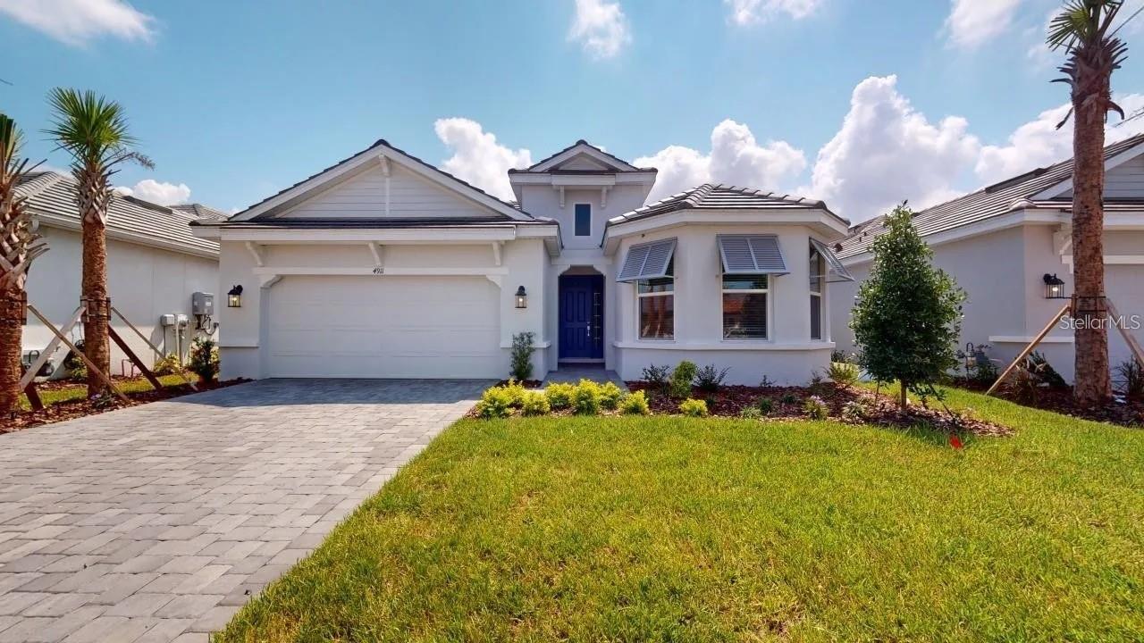 Welcome Home to Resort-Style Living in Esplanade at Artisan Lakes!

Nestled within one of the area's most coveted communities, this stunning 3-bedroom, 2-bath home built by the renowned Taylor Morrison is a rare opportunity to embrace the very best of Florida living. Featuring the highly desirable Azzurro floor plan, this residence has been thoughtfully designed to maximize both comfort and style — and from the moment you step inside, you'll be captivated by the elegant finishes, intuitive layout, and effortless charm that make this home truly one of a kind.

The open-concept floor plan flows beautifully from room to room, with gleaming tile flooring throughout that's as stunning as it is easy to maintain. At the heart of the home, a chef-inspired kitchen takes center stage — featuring sleek modern finishes, generous cabinetry, and a large island that invites friends and family to gather. Whether you're hosting a dinner party or enjoying a quiet morning coffee, this space adapts effortlessly to your lifestyle.

Retreat to your private sanctuary in the expansive primary suite, where a generous walk-in closet and a spa-like en-suite bath — complete with dual vanities and a walk-in shower — make every day feel like a getaway.
Step outside and discover your own slice of paradise. The extended screened lanai offers the ideal setting for alfresco dining, evening cocktails, or simply soaking in the serene Florida air. With no backyard neighbors, you'll enjoy a sense of peaceful seclusion that's truly priceless.

Beyond your front door, Esplanade at Artisan Lakes delivers a resort-caliber lifestyle at every turn. Cool off and unwind at not one, but two stunning resort-style pools designed to make every day feel like a vacation. Challenge friends to a match on the pickleball or tennis courts, then take a leisurely stroll along the community's beautifully maintained walking paths. When it's time to recharge, the state-of-the-art workout facility has everything you need to look and feel your best. Best of all, the community's vibrant calendar of resident events — thoughtfully curated for all ages — ensures there's always something exciting to do, someone new to meet, and memories waiting to be made. This is the kind of neighborhood where you don't just live — you truly belong.

And when the world calls, you're perfectly positioned to answer — with quick access to I-75, premier shopping and dining, top-tier medical facilities, major airports, and the Gulf Coast's world-renowned, award-winning beaches just a short drive away.
Move-in ready and waiting for you — this is more than a home. It's a lifestyle.