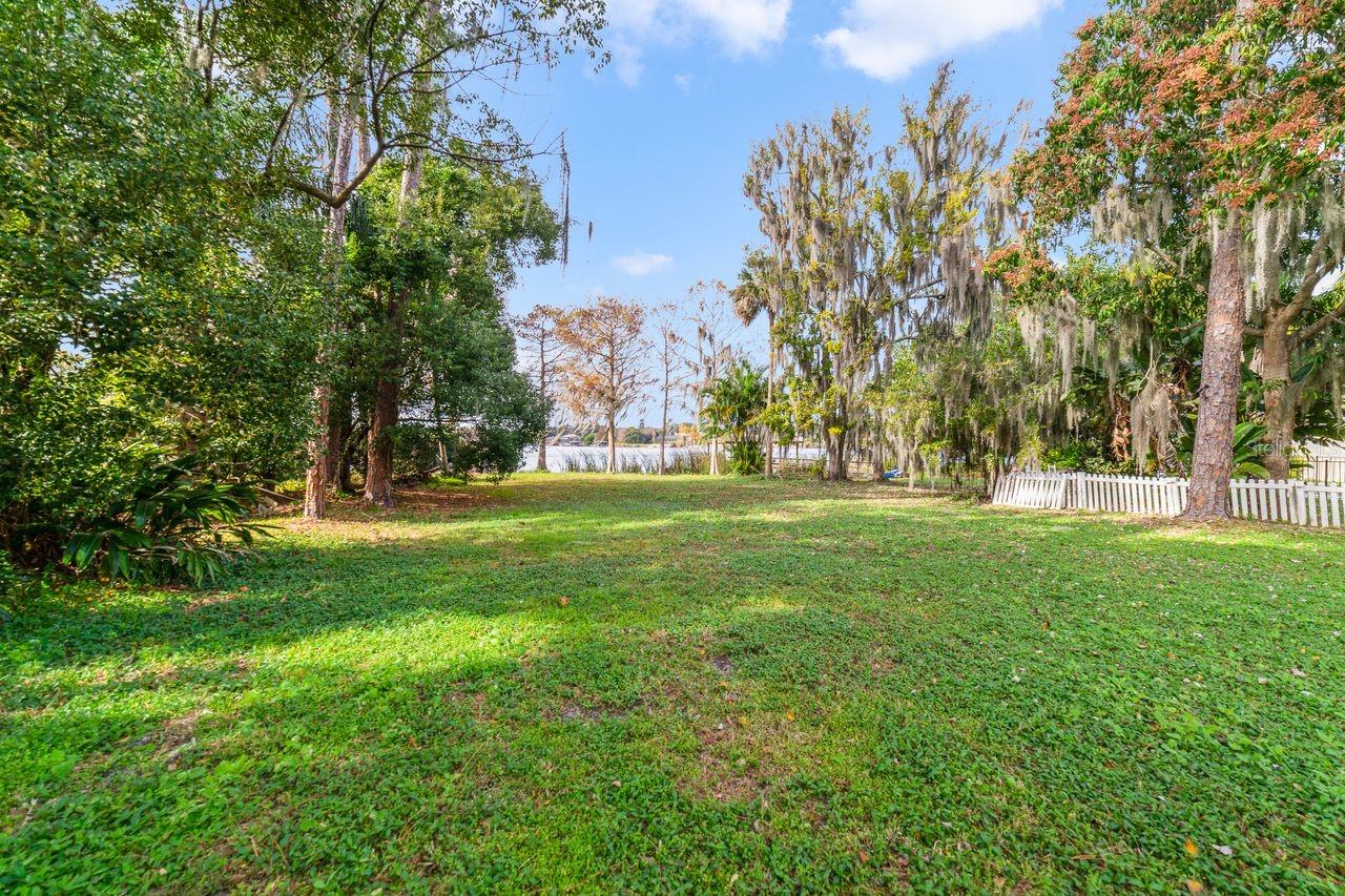 Reduced!! Reduced!!! Owner says SALE!! Stunning 3/4 Waterfront Acre on Lake Irma– Your Dream Home Awaits! Embrace the ultimate in luxury living with this rare opportunity to own a pristine waterfront lot on the serene shores of Lake Irma in beautiful East Orlando. This exquisite lot offers the perfect canvas to build your custom dream home in a tranquil setting. This lot combines the peaceful ambiance of lakeside living with the convenience of being just minutes away from Winter Park's vibrant restaurants, and top-rated schools, including Trinity Prep School (just a 
5-minute drive), 20 minutes to MCO airport, and a short trip to shopping, dining, and entertainment. With direct access to the water, indulge in endless recreational activities such as boating, fishing, kayaking, or simply relaxing by the shore. With approximately 1/4 acre of buildable land and a wide lot, you have ample space to design and build your dream home, lush gardens, outdoor living areas, and more. The possibilities are endless. The lot boasts mature trees, providing privacy. Wake up to the soothing sounds of nature and experience stunning sunsets over the lake each evening. Work with your preferred architect and builder to create a home that perfectly reflects your style and needs. Whether you envision a modern architectural masterpiece or a charming lakeside cottage, this lot can accommodate your vision. Lake Irma is a hidden gem in East Orlando, offering natural beauty with its migratory birds, conservation lands, a private slalom ski course and many newly constructed custom homes. This lake secluded retreat is still close to everything in east Orlando/Winter Park.
Don’t miss this extraordinary opportunity to create your own waterfront sanctuary on Lake Irma. Contact us today to schedule a private viewing and start planning the home of your dreams.