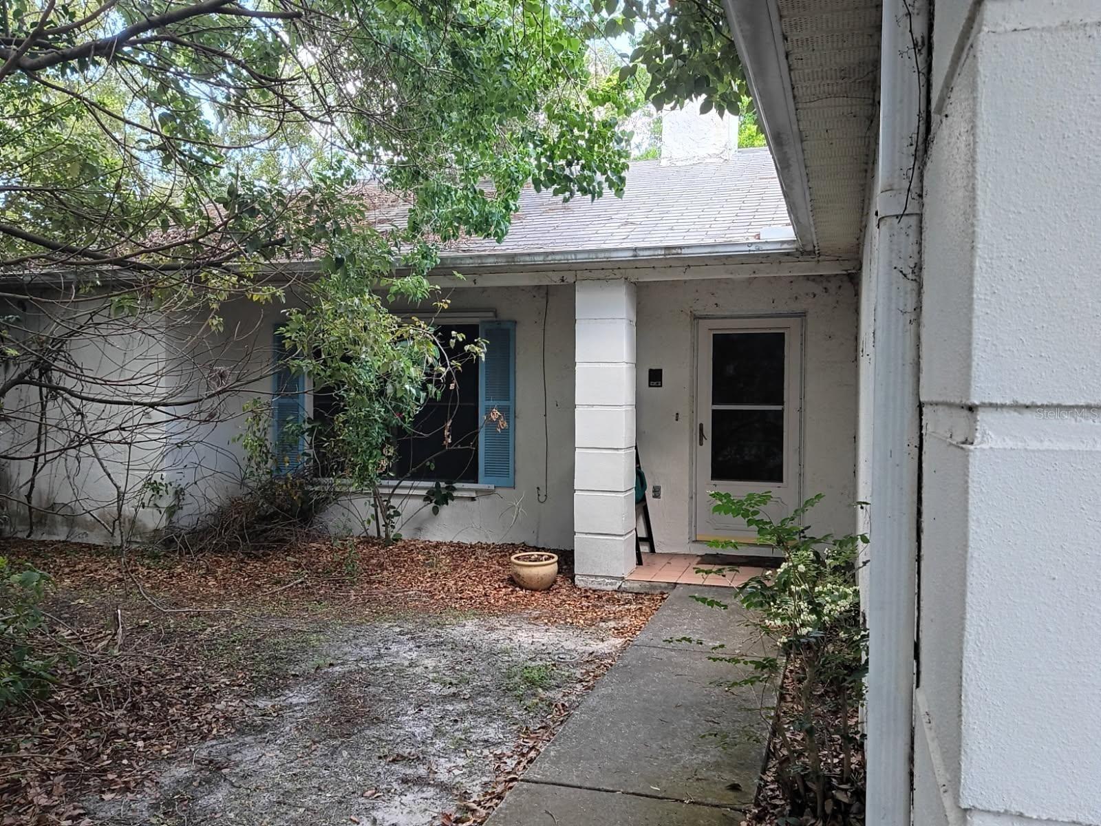 AS-IS, home needs some TLC paint, flooring, new water heater (2026), A/C (2023) , two bedroom, two bath, indoor laundry room with sink, wood burning fireplace, eat in kitchen with breakfast bar with additional sink, nice size screen porch perfect for relaxing with your early morning coffee or after a long day at work. Master Bedroom has attached office/den.
Has great potential for a first home, winter get away or investment home. Hurricane shutters are included.