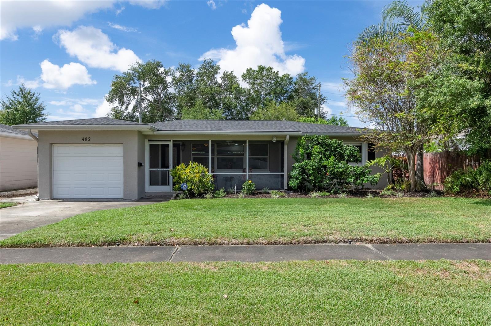 High-and-Dry 2-bedroom 2-bath 1 car garage home . Enjoy total comfort and efficiency with a brand-new roof (2026) and a brand-new A/C system (2026). The home boasts excellent curb appeal with fresh interior and exterior paint (2023), durable flooring, stylish ceiling fans, and charming built-in features that add character and storage. The functional layout features a dedicated study/flex space, a convenient 1-car garage, and a welcoming, enclosed front screened porch—perfect for sipping your morning coffee. This massive outdoor space features a tranquil flower garden and a serene pond. Fully enclosed by a newer fence (2023). With abundant room to spare, this backyard is a blank canvas ready for your future swimming pool or custom outdoor kitchen. Location is everything! You are just minutes away from the vibrant energy of Downtown St. Pete, the iconic St. Pete Pier, waterfront parks, and award-winning Gulf beaches. Commuting is a breeze with easy access to South Tampa. For daily conveniences, you are spoiled for choice with Fossil Park, the bustling 4th Street corridor, two Publix locations, Whole Foods, Fresh Market, and Trader Joe’s just moments from your door