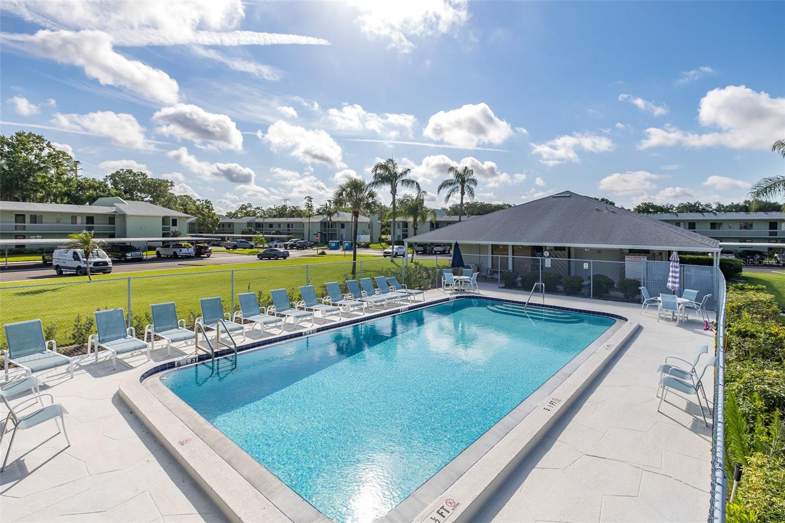 "RESORT STYLE LIVING" in East Lake Woodlands!  This beautifully maintained 2-bedroom,2-bath condominium offers approximately 1,151 sq ft of comfortable living space in one of Oldsmar’s most desirable gated communities. Major updates provide peace of mind, including flooring, A/C system, hot water heater, dishwasher, washer and dryer, and bedroom carpeting all approximately 3 years old, plus a refrigerator replaced in 2025. The open living and dining areas create an inviting space for entertaining, Move-in ready, thoughtfully designed and updated this home features a spacious layout, abundant natural light, and a screened lanai—perfect for enjoying Florida’s year-round lifestyle. Enjoy the convenience of covered parking and maintenance-free living. Residents enjoy access to a community pool, pool club house, beautifully maintained grounds, and optional country club amenities including golf, tennis, fitness, and social activities. Ideally located near shopping, dining, parks, beaches, Tampa International Airport, and top Pinellas destinations, this condo offers the perfect blend of convenience, value, and resort-style living. Whether you’re looking for a full-time residence, seasonal retreat, or investment opportunity, this East Lake Woodlands gem is one you won’t want to miss!