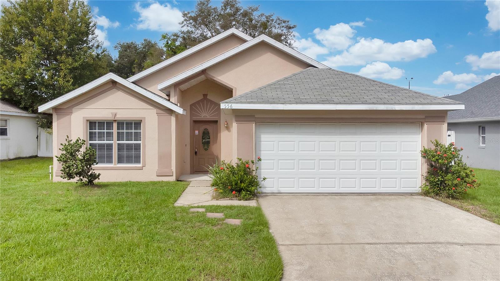 Take advantage of a 2% Seller-Paid Rate Buydown, offering you an even easier path to homeownership (terms and conditions apply). Discover the simplicity of this 3-bedroom, 2-bathroom pool home situated in the homely Apopka neighborhood of Magnolia Oaks Ridge, ready for your personal touch. Spanning 1,617 square feet, this home provides a vaulted ceiling, tile and wood laminate flooring throughout, enveloped in a neutral color scheme. The functional kitchen, equipped with newer appliances, transitions smoothly into an open floor plan, facilitating both daily living and entertaining. Two cozy guest bedrooms are ready to host, while the master suite offers a walk-in closet, dual vanity, and a separate shower and tub for a private retreat. Outside, a delightful pool awaits, encircled by a fully fenced yard, offering a sense of security as you enjoy your outdoor oasis. This home holds the promise of comfort, paired with the opportunity to infuse your own style, making it a truly inviting prospect.<div style="padding:56.25% 0 0 0;position:relative;"><iframe src="https://my.matterport.com/show/?m=xR6CythVjf5&mls=1" frameborder="0" allow="autoplay; fullscreen" allowfullscreen style="position:absolute;top:0;left:0;width:100%;height:100%;"></iframe></div>