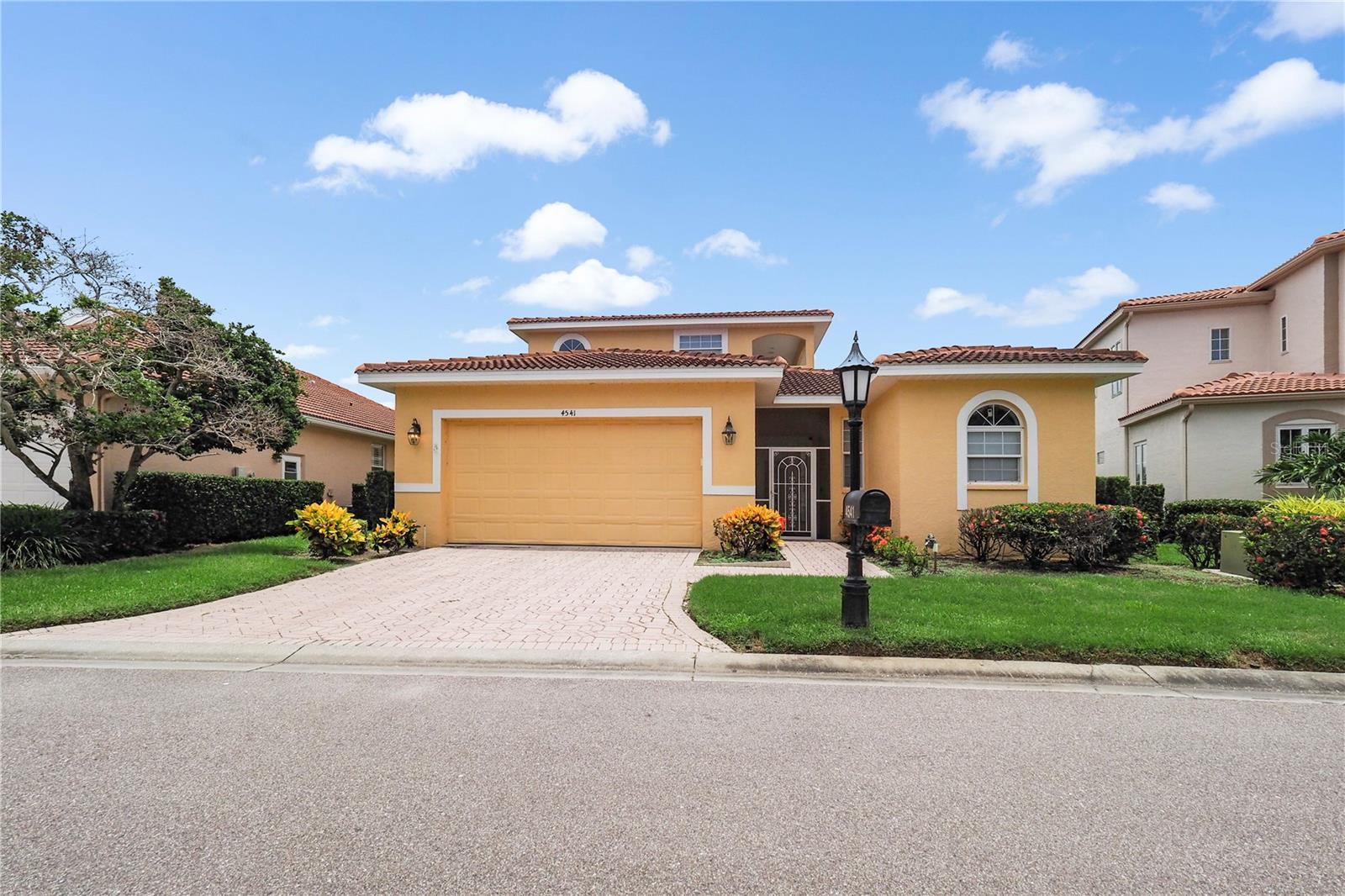 NEW LOW PRICE!!!! PRICED to SELL!!! Move-in Ready!!!
Nestled behind the private gates of the beautifully landscaped TPC PRESTANCIA, this maintenance-free, stand-alone two-story residence offers over 3200 sq. ft. of exceptional Florida living. Perfectly positioned on a quiet cul-de-sac, the home delivers privacy, elegance, and sweeping golf course views.
"The thoughtfully designed floor plan centers around a serene courtyard-style pool with a tranquil water feature and recently redone pavers,  accessible from multiple rooms and ideal for indoor-outdoor living."
Step into the impressive living and dining area, where soaring ceilings, refine crown molding, and expansive picture windows frame a panoramic vista of the #7 green, #8 tee boxes ,fairway, and a picturesque lake on the TPC Stadium Course -- one of Prestancia's two championship courses and a haven for local birdlife.
The spacious well-equipped kitchen features a center island with sink and disposal, generous storage, and seamless flow into the casual family room and breakfast nook. A charming bay window overlooks the pool, filling the space with natural light.
The first-floor primary suite offers comfort and convenience with two custom walk-in closets (plus another large closet), a bright bathroom with dual sinks, and direct access to pool area. Upstairs, two large guest ensuite bedrooms provide privacy for visitors, each opening to a long, wide balcony with elevated golf course views.
A versatile fourth bedroom/casita sits off the courtyard on the main level--complete with a full bathroom, built-in desk and Murphy bed --making it an ideal office, guest suite, or " man cave."
Additional features include a half bath, laundry room, and an oversized two-car garage. Golf membership is optional, not required.
Located just minutes from Siesta Key Beach, top-tier dining and shopping, and Sarasota's renowned art and culture scene, this home blends luxury, convenience, and lifestyle in oneof the area's most desirable communities.