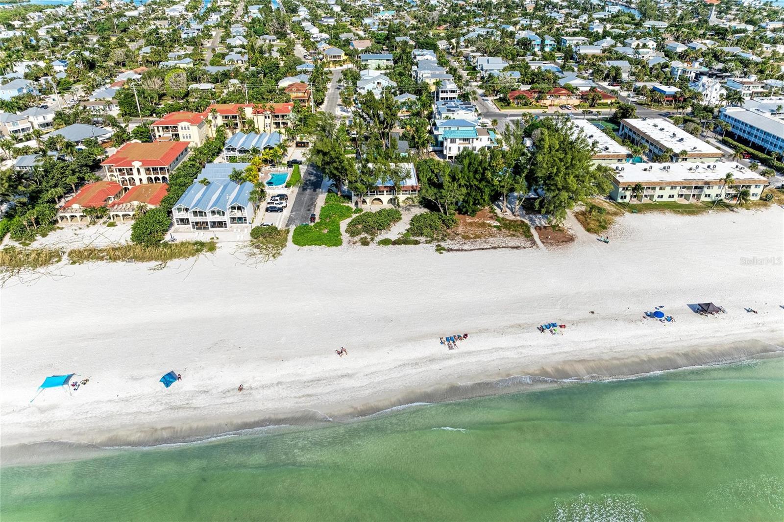 One or more photo(s) has been virtually staged. This is your golden moment. Units 1, 2, 3 are all listed for sale and zoned for nightly rentals. Beachfront boutique building is comprised of only six units. This renovated two-bedroom, two-bath unit has magnificent views with shells and sand at your back patio that lead you to the private path, which opens to the breathtaking sands of the Gulf of Mexico. This is a rare opportunity as unique buildings like these are few and far between. It could be the ideal place to call home or to use as a weekly rental. The condominium association fee includes exterior maintenance, cable, water, sewer and trash. One pet allowed with no weight limit. The roof and air-conditioning unit were installed in 2025. Make your appointment today to be one of the premier owners of this boutique beachfront condominium.