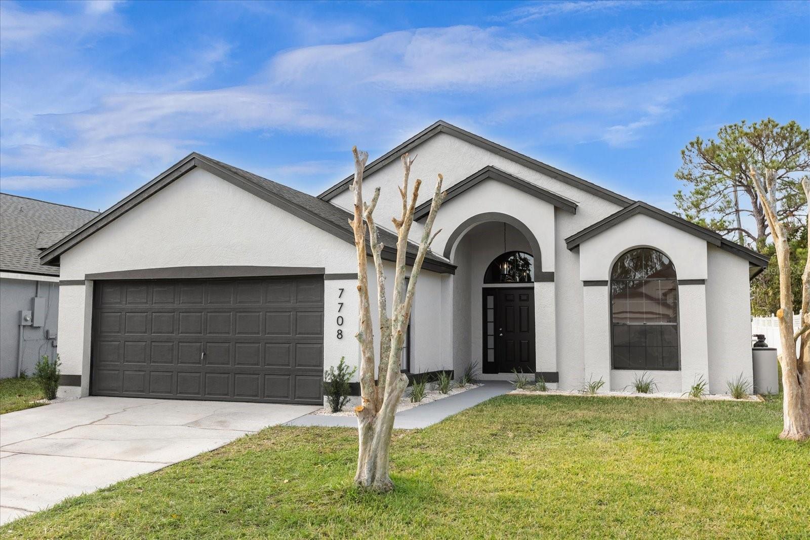 One or more photo(s) has been virtually staged. Fall in love with this freshly updated 3 bedroom, 2 bathroom Orlando home! 

This spacious, open floor plan design is freshly painted inside and out, and features an entirely new kitchen with what has mostly likely the largest quartz countertop breakfast bar you have ever seen! 

With all new stainless steel appliances and kitchen cabinets, designer backsplash and hardware, this is an ideal layout for anyone looking for a bright and airy open floor plan that is perfect for entertaining. Along with offering multiple living, dining and entertaining areas, the primary living area leads into the well sized screened patio for additional space to enjoy. 

This home has all new wood laminate flooring and baseboards throughout the living areas and bedrooms with gorgeous porcelain tile in the kitchen and bathrooms. 

Other updates on this home include a BRAND NEW ROOF, all new plumbing, new water heater, new fixtures throughout, updated bathrooms with new toilets, vanities, fixtures and much more! Do not miss out on this centrally located, freshly renovated Orlando home!