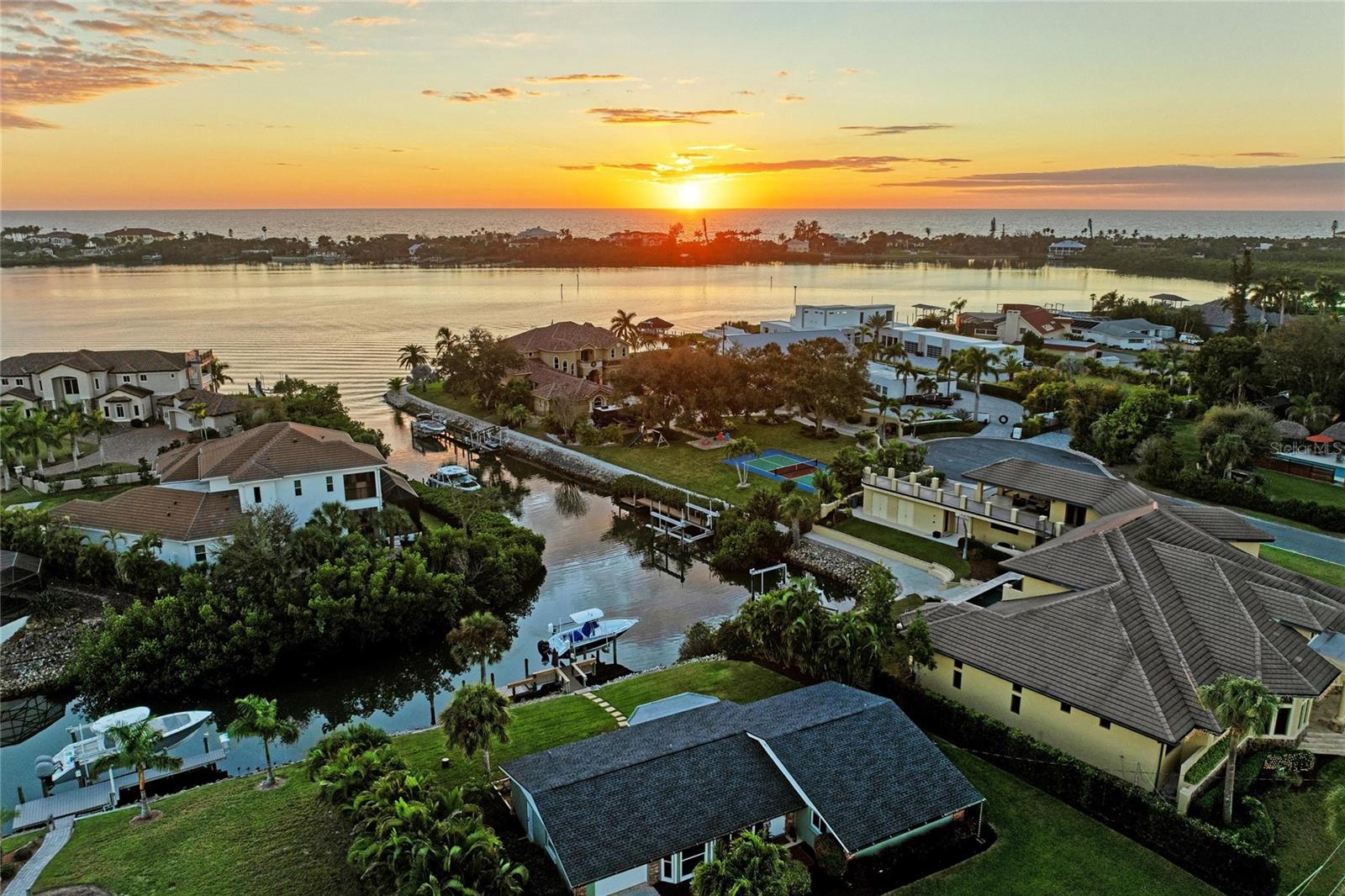 Wake up to ever-changing INTRACOASTAL VIEWS – SUNSETS dancing across the water, BOATS gliding by, and untouched wildlife. Set on an EXTRA-DEEP WATER FRONT LOT with GULF ACCESS, this exceptional residence offers a rare blend of privacy, sweeping WATERFRONT views, timeless COASTAL DESIGN, and a DOCK WITH A 10,000LB BOAT LIFT that places open water just minutes away. A BOATERS PARADISE, this refined home remains unaffected by flooding AND IN FLOOD ZONE X, unfolds safely toward the water where EXPANSIVE BAY WINDOWS frame uninterrupted scenery. Step out your back door and hop on your boat for effortless days on the water in a premium location.

FULLY FURNISHED! Offering 3 BEDROOMS, 2 FULL BATHROOMS, and 1,846 square feet of true Florida living, this home’s PANORAMIC VIEWS flood it with natural light and blur the line between indoors and out. PGT IMPACT WINDOWS, ELECTRONIC SHUTTERS, rich WOOD PANELING, and CROWN MOLDING lend architectural depth and timeless coastal sophistication, creating a home that feels calm, luminous, and deeply connected to its surroundings.

The kitchen features QUARTZ countertops, a GRANITE COMPOSITE SINK, and UPGRADED FIXTURES. CEDAR-accented guest bedroom ceilings, CUSTOM built-in closets throughout, and NEW LIGHTING reflect thoughtful stewardship. ADDITIONAL UPGRADES include a new REVERSE OSMOSIS WATER FILTERATION SYSTEM AND WATER HEATER (2023) and AIR DUCTS (2025).

Outdoor living is the centerpiece. The PRIVATE DOCK AND OUTDOOR FIRE PIT are natural extensions of the home, inviting morning coffee, sunset cocktails, and manatee sightings. Boat amenities were meticulously maintained with NEW MOTOR CAPACITORS (2023), and BOAT LIFT CABLES AND DOCK LIGHTS (2024). Lush landscaping in the GENEROUS FRONT YARD enhances curb appeal, while mature trees provide tropical PRIVACY, with plenty of room for a POOL. 

Homes with this DEPTH, PRIVACY, and INTRACOASTAL ACCESS are RARELY available. This is not simply a WATERFRONT HOME – it is a BOATING LIFESTYLE defined by light, movement, and an ever-changing horizon.

Just a 2 minute boat ride to the Intracoastal Waterway, 25 minutes to the Gulf of Mexico and 10 minutes to Casey Key Fish House and Tiki Bar! Call for a private tour of this beauty!