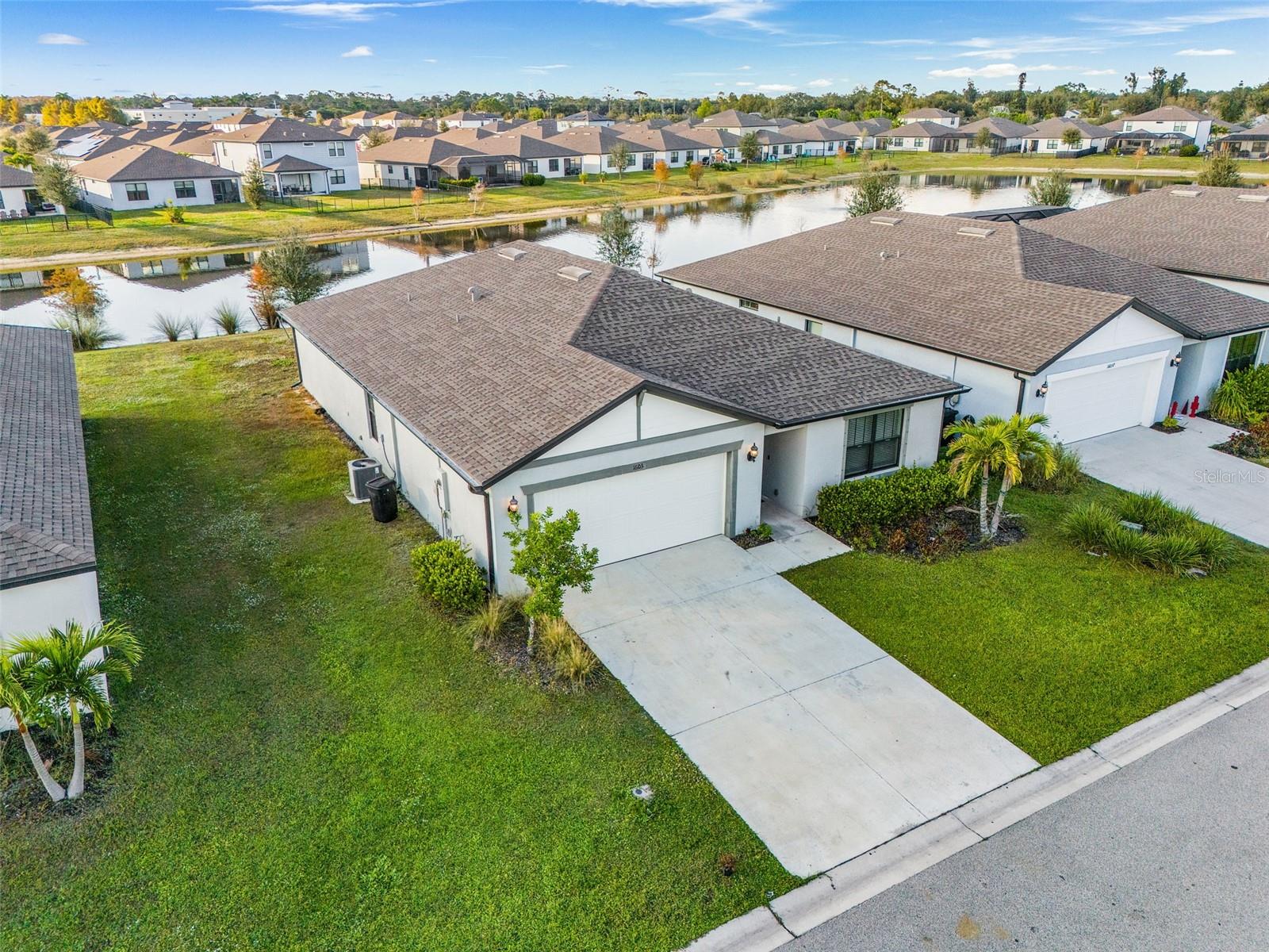 Motivated seller offering closing cost assistance - bring your buyers and offers! Welcome to 16033 Beachberry Dr, a beautifully appointed single-story home in the heart of North Fort Myers, offering both comfort and scenic tranquility. This 4-bedroom, 2-bath residence features a thoughtfully designed open floor plan that seamlessly connects the living, dining, and kitchen areas, making it ideal for both everyday living and entertaining. Large windows throughout the home invite abundant natural light and showcase the stunning water views, creating a calm and inviting atmosphere. The spacious kitchen is well-equipped with ample cabinetry and counter space, overlooking the main living area so you never miss a moment while hosting family or guests. The split-bedroom layout offers added privacy, with the primary suite tucked away as a true retreat, complete with a generous walk-in closet and an en-suite bathroom. Three additional bedrooms provide flexibility for guests, a home office, or hobby space. Step outside to enjoy peaceful water views that enhance the Florida lifestyle—perfect for relaxing mornings, evening unwinding, or weekend gatherings. The single-story design ensures easy accessibility and convenient living. Located close to shopping, dining, schools, and major roadways, this home combines location, value, and natural beauty. NO CDD with low taxes, making it an even more attractive opportunity. Don’t miss your chance to own this inviting home—schedule your private showing today.