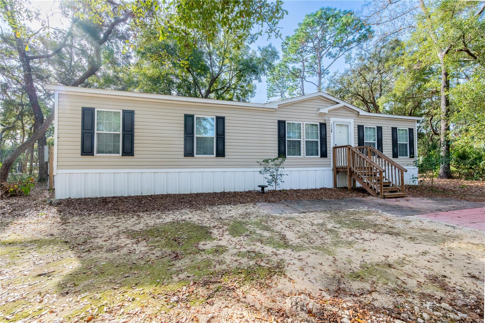 Seller is willing to consider buyer concessions toward closing costs, prepaid expenses, or rate buy-down
Practically Brand-New 2021 Home on Nearly Half an Acre – Fully Fenced & Move-In Ready

This well-maintained 2021 manufactured home offers modern comfort, thoughtful upgrades, and a peaceful rural setting just off Camp Azalea Road in Chiefland. Situated on a fully fenced 0.46-acre lot, the property provides space, privacy, and flexibility for everyday living.

Inside, you’ll find a spacious 4-bedroom, 2-bath layout with an open-concept design centered around a large granite kitchen island—perfect for cooking, gathering, and entertaining. The home has been carefully maintained and includes quality finishes throughout.

Outside, the property continues to impress with underground utilities, a water softener system, mature citrus trees, and a 12x20 storage shed for tools, hobbies, or extra storage needs. The fenced yard offers plenty of usable space for pets, gardening, or outdoor enjoyment.

Located just minutes from Manatee Springs State Park, the Suwannee River boat ramps at Camp Azalea and Clay Landing, and the Chiefland Golf & Country Club, this home offers convenient access to some of the area’s best outdoor recreation while still being close to town amenities.

Highlights:

2021 built home – move-in ready condition
4 bedrooms / 2 bathrooms
Open floor plan with granite kitchen island
Fully fenced 0.46-acre lot
Underground utilities & water softener system
12x20 storage shed included
Minutes to springs, river access, golf, and town

A great option for anyone seeking modern living