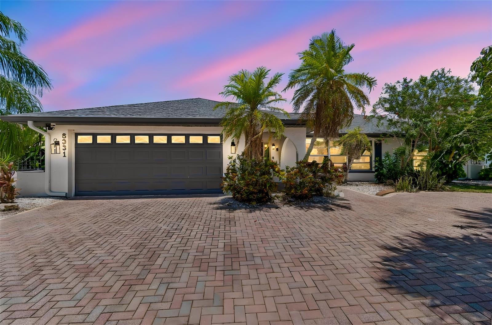 Welcome to your own waterfront retreat! This beautifully updated 4-bedroom, 2-bath pool home offers the perfect blend of comfort, style, and Florida living. Situated on a canal with a private dock and direct access to Tampa Bay with no bridges and NO HOA, this property is a dream for boaters and water enthusiasts. Inside, the desirable split-bedroom floor plan provides both privacy and functionality. Bright, open living spaces feature modern updates throughout, while the renovated kitchen overlooks the pool and canal through charming sliding pass-through windows and flows seamlessly into the living and dining areas, perfect for everyday living and entertaining. The home also includes a large shed, new stainless steel appliances, including the refrigerator, dishwasher, microwave, washer, and dryer. Designed for efficiency and peace of mind, the home features R-38 attic insulation, a new roof (2024), and a new pool screen enclosure (2025). Step outside through one of four sliding glass doors to your private backyard oasis featuring a sparkling screened pool, spacious lanai, private dock, and tranquil canal views. Whether you're enjoying your morning coffee, entertaining guests, or heading out for a day on the water, this home embraces the best of the Florida waterfront lifestyle. Additional highlights include generously sized bedrooms, updated bathrooms, ample storage, and plenty of space for family and friends. Conveniently located near shopping, dining, schools, and major roadways, you'll enjoy peaceful waterfront living without sacrificing everyday convenience. With direct access to Tampa Bay, no bridges, no HOA, a private dock, and major recent upgrades, opportunities like this are rare. Whether you're searching for a primary residence, vacation home, or income-producing short-term rental, this property checks every box. Furniture and decor are available separately. Schedule your private showing today!