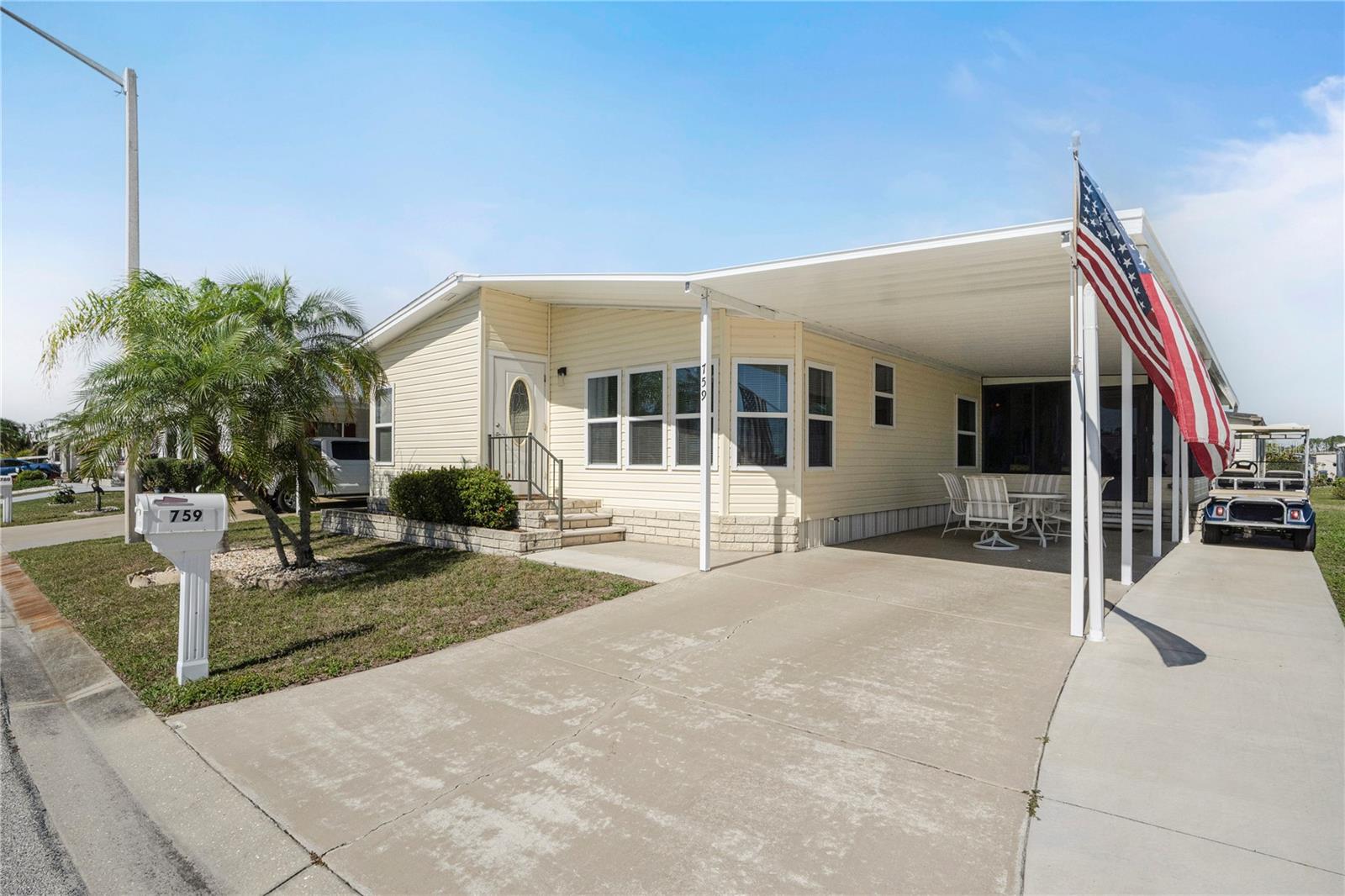 $29K PRICE REDUCTION on this Stunning furnished home in 55+ GULF ACCESS waterfront community with serene lake views! Wow, prepare to be impressed. This stylish and spacious 2-bedroom, 2-bathroom residence has water views, an upscale coastal vibe and a long list of recent upgrades. Beautifully furnished with golf cart included, this 1,464 SF home is one of the larger ones in the community.  Enter into light filled rooms, cathedral ceilings, extra wide hallways and a calming, neutral color palette with lovely accents and artwork. Relax or entertain while taking in sparkling lake views from the front wall of windows or the comfy, elevated, air-conditioned and enclosed lanai. So much space here! A huge well-appointed living room, charming dining area with display and storage cabinetry, nice kitchen with pantry and updated countertops, roomy 240 SF primary suite with walk-in closet and French doors to the ensuite bathroom plus a 2nd bedroom that would please any guest. This property features updates that ensure comfort and convenience: a roof and A/C system only 2.5 years old, beautiful luxury vinyl flooring, updated windows for energy efficiency, vinyl siding, gutters and downspouts, lanai mini-split, shower surround, paint, etc. As part of this vibrant community, enjoy Gulf access via the Myakka River with a rare 90-slip marina—perfect for boating and fishing enthusiasts. With low HOA fees of $150 per month and an optional boat slip for only $100 annually, this is an opportunity not to be missed. Amenities include two pools, a spa, massive clubhouse with dances, parties, talent shows, trivia, card games and more. Close to beaches, dining, shopping, farmers markets and quality medical services. Whether you're looking for a permanent residence or a seasonal getaway, this home offers casual elegance with modern amenities in a very scenic setting. Don’t wait—schedule your private tour today and experience firsthand all that this exceptional property has to offer!