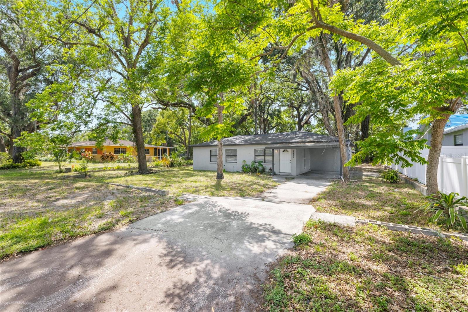 Virtually Staged. Don't miss this one. A 3 bedroom, 2.5 bath block home sitting on a beautifully large .23 acre lot in Tampa, a lot size that's hard to come by at this price. Picture the possibilities: room for a fenced backyard, a garden, a fire pit, or just space to breathe. Inside, you'll find 1,340 square feet with a smart, comfortable layout. Major updates include a new roof in 2022 and new AC, plumbing, and electrical all done in 2023. Just minutes from Seminole Heights' beloved restaurants and local hangouts, plus easy access to Downtown Tampa, Ybor City, and major roads, this location puts you close to it all. Whether you're buying your first home or growing your investment portfolio, this one's worth a look.