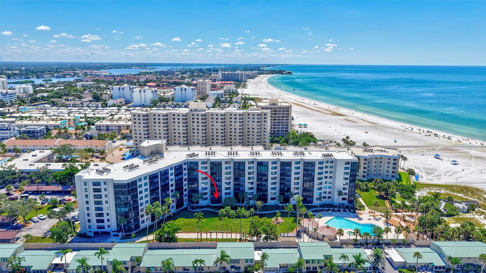 Find your beach get-away in this remodeled three-bedroom Casarina condo located on Siesta Key’s famous Crescent Beach. This stunning TURNKEY FURNISHED and updated unit includes an open concept kitchen with high-end custom soft-close cabinetry, designer hardware and granite countertops. The great room was extended to incorporate the balcony into the living space creating an open and airy feeling to this home. A wall mounted television with Sonos audio provides family entertainment. The spacious primary bedroom with a Closet Tech designed walk-in closet opens to a large bathroom with custom cabinets, dual sinks and large walk-in shower. A third bedroom was created during the recent remodel and includes a built-in under window desk. The full-sized laundry room allows for plenty of storage. Luxury vinyl flooring was installed in 2020 in all public rooms. Impact windows were added in 2016. Electric blinds can close off the sliding glass doors to the outside view while all other windows have custom designed plantation shutters. Crown molding and solid wood doors are found throughout the unit. Casarina is an 89-unit condominium complex that sits on 200 feet of private beach and encompasses 7 acres of tropical landscaping. The complex has a clubhouse with kitchen. Spend your days enjoying the beachside pool and spa, play a game of pickleball on one of the two lighted tennis courts, or relax on the island’s famous crystal sand beach. Hop on the free trolley to enjoy the dining, shopping and entertainment at Siesta Key Village. CASARINA ALLOWS OWNERS ONE SMALL PET.