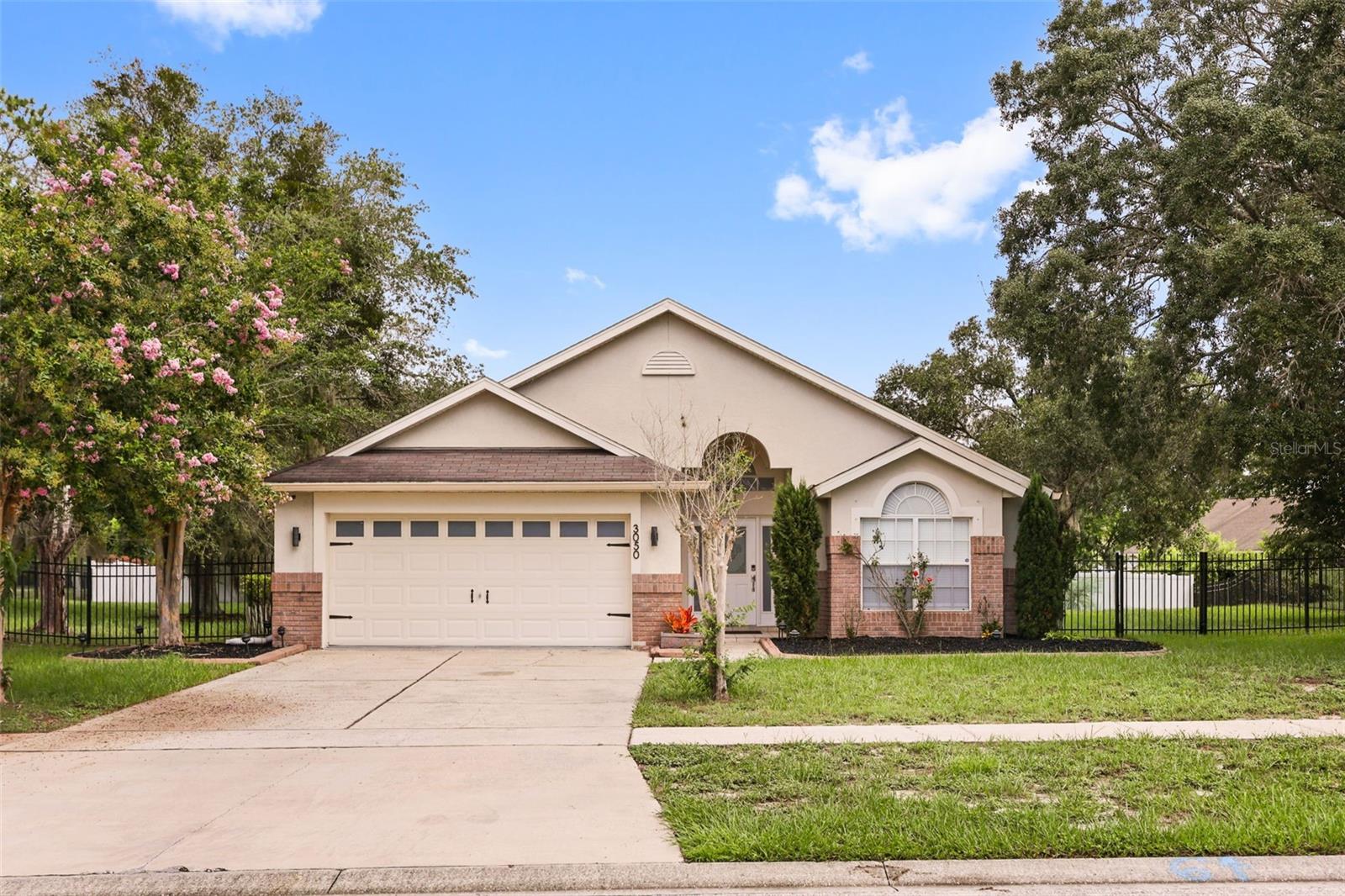 Welcome to your private Florida oasis at 3050 Mountel Ave! Nestled on an expansive 0.47-acre corner lot, this beautifully maintained home offers the perfect blend of modern indoor comfort and ultimate outdoor entertainment. Step inside to discover a bright, updated open floor plan designed for effortless living and entertaining. The spacious layout seamlessly connects the living, dining, and kitchen areas, flooding the home with natural light and providing the perfect backdrop for family gatherings or quiet evenings.The highlight of this property awaits just outside your back door. Step into your private paradise featuring a pristine screened-in pool, your personal retreat for cooling off on hot summer days, hosting weekend barbecues, or enjoying peaceful morning coffee free of pests.