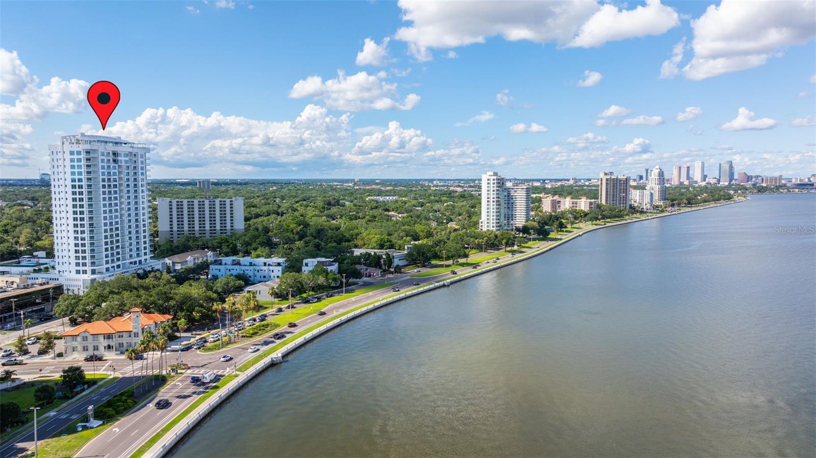 Seller may consider buyer concessions if made in an offer. Immerse yourself in sky luxury living! Located on the eighth floor, this splendid residence offers breathtaking waterfront views of the bay and Tampa's formidable skyline. Altura Bayshore, rising above Bayshore Blvd., offers an unprecedented rooftop experience, including a sky pool, sunrise and sunset views, water views, and this striking, ample, and modern brand-new condo.

The concierge welcomes you to the elegant lobby with exquisite decor, marking the start of a magnificent resort lifestyle!

This residence boasts 2,896 SF and has been designed with front-to-back, floor-to-ceiling glass, and numerous windows for unparalleled views. It features a private elevator foyer to greet your guests, three Bedrooms, a den that can be converted to 4th Bedroom, three Bathrooms, a terrace, a balcony, two reserved parking spots, and EV charging. This impressive total of 3,252 SF makes this property feel like a spacious home.

The flooring, counters, cabinetry, and doors are tasteful, and high-quality upgrades were selected to create sophisticated and welcoming spaces. The porcelain flooring is Daltile Hill House Natural 6x36 herringbone pattern, and the countertops are Silestone Hybriq+.

The gourmet kitchen is the ultimate display of personalization, superior craftsmanship, attention to detail, and elegant finishes. It is designed with an expansive island, upgraded cabinetry with added pantries, undercabinet lighting, and surplus cabinets under the island. Appliances include a Thermador cooktop and double ovens, a Fisher & Paykle dishwasher, a Miele refrigerator, and a freezer with seamless paneling.
 
The Owner's retreat has gorgeous bay views, terrace access, a generous walk-in closet, and a magnificent spa-like bath. Secondary bedrooms are spacious and offer great views.
 
Two expansive amenity decks with glass rail for unobstructed views feature a large rooftop pool with a lap lane and sun shelf, cabanas, and lounges, a large trellis-covered spa and bar, flat-screen TV, BBQ grills, and swing chairs. The fire pit section overlooks the bay.
 
Inside, you will enjoy the private club room with a gas fireplace, casual seating, a large bar, and flat-screen TVs, perfect for entertaining.

On the 4th floor, you will find a fully equipped fitness center, putting green, fire pit, outdoor pickleball, half-court basketball, bocce courts, bar and grill areas, a wonderful dog park with shade pavilion, and convenient access to Guest Suites.

Additional features include a 24-hour front desk, secured garage storage space, and HVAC UV light. Stacked double Miele washer and dryer in laundry room with convenient built-ins.

Prime South Tampa, walkable, waterfront location with easy access to some of the area's most popular destinations for shopping, dining, and nightlife. Minutes from downtown, Tampa's cultural center and activities, business district, sporting events, and top-rated schools. Close to Tampa General Hospital, UT, International Airport, Riverwalk, Waterstreet, Amalie Arena, Channelside, and easy access to major highways. Short distance to a private airport and yacht club.