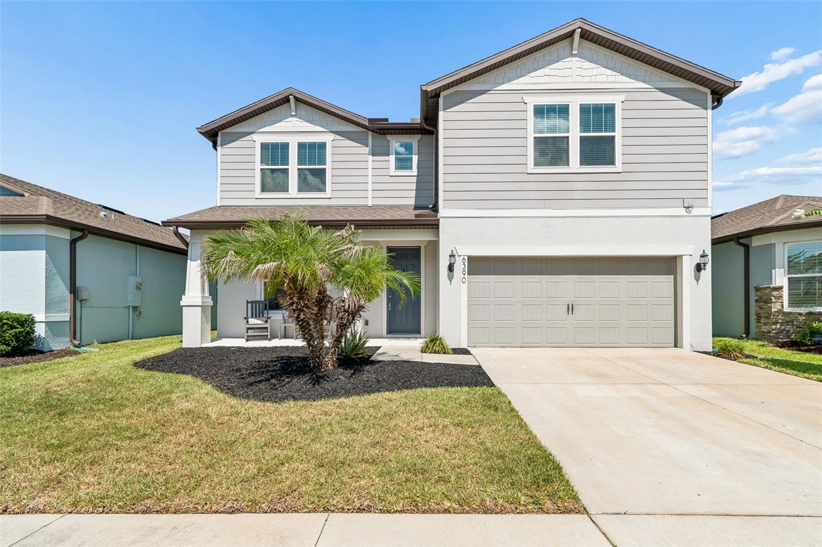Welcome to this beautifully maintained 2021 home in the gated community of Oaks of Pasco. Offering 4 bedrooms, 2.5 bathrooms, a dedicated home office, and an expansive 20' x 20' loft, this thoughtfully designed home combines modern elegance with everyday functionality. The open-concept floor plan features soaring ceilings, luxury vinyl plank flooring, and a spacious great room that flows seamlessly into a stunning chef's kitchen complete with quartz countertops, shaker cabinetry, stainless steel appliances, double wall ovens, a walk-in pantry, and an oversized center island perfect for gathering and entertaining. The first-floor primary suite offers privacy, generous walk-in closets, and a beautifully appointed bath, while the upstairs loft provides the perfect space for a media room, game room, or second living area. Step outside to the covered lanai and enjoy peaceful pond and conservation views with no direct rear neighbors. Additional features include a whole-home water softener and filtration system, low HOA fees, and no CDD. Ideally located just minutes from SR-54, US-301, Publix, shopping, dining, medical facilities, Wesley Chapel, and Epperson Lagoon, this move-in-ready home offers the perfect blend of style, comfort, and convenience.