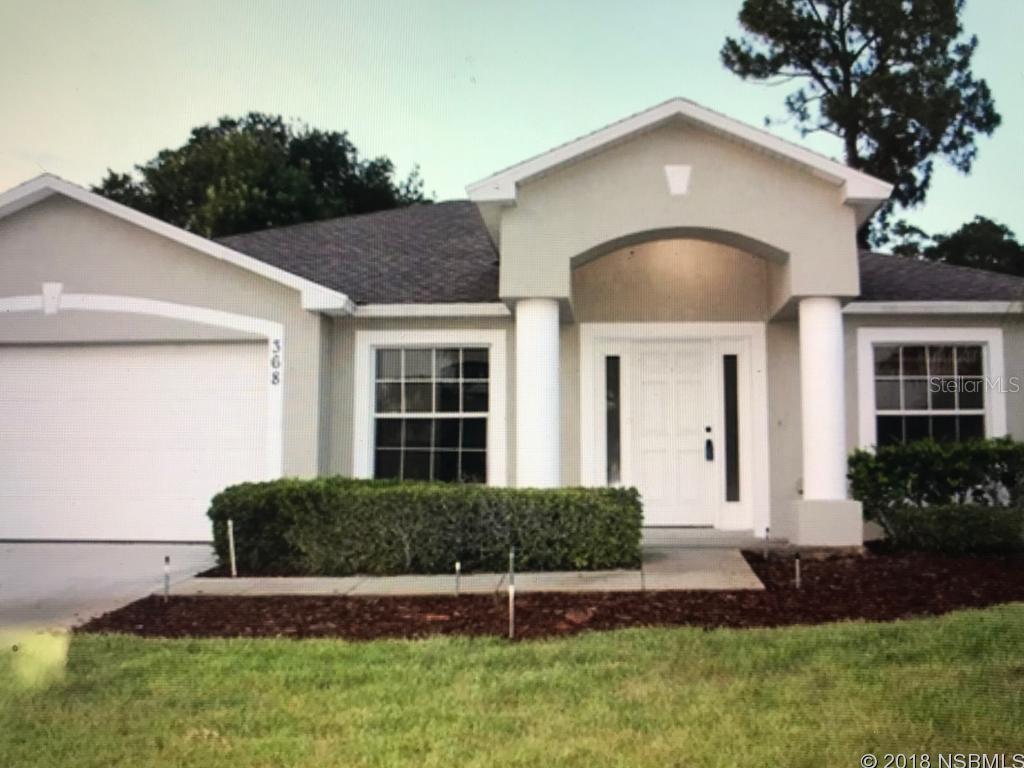 Lovely 3/2 split plan block home with 2-car garage and screened porch.