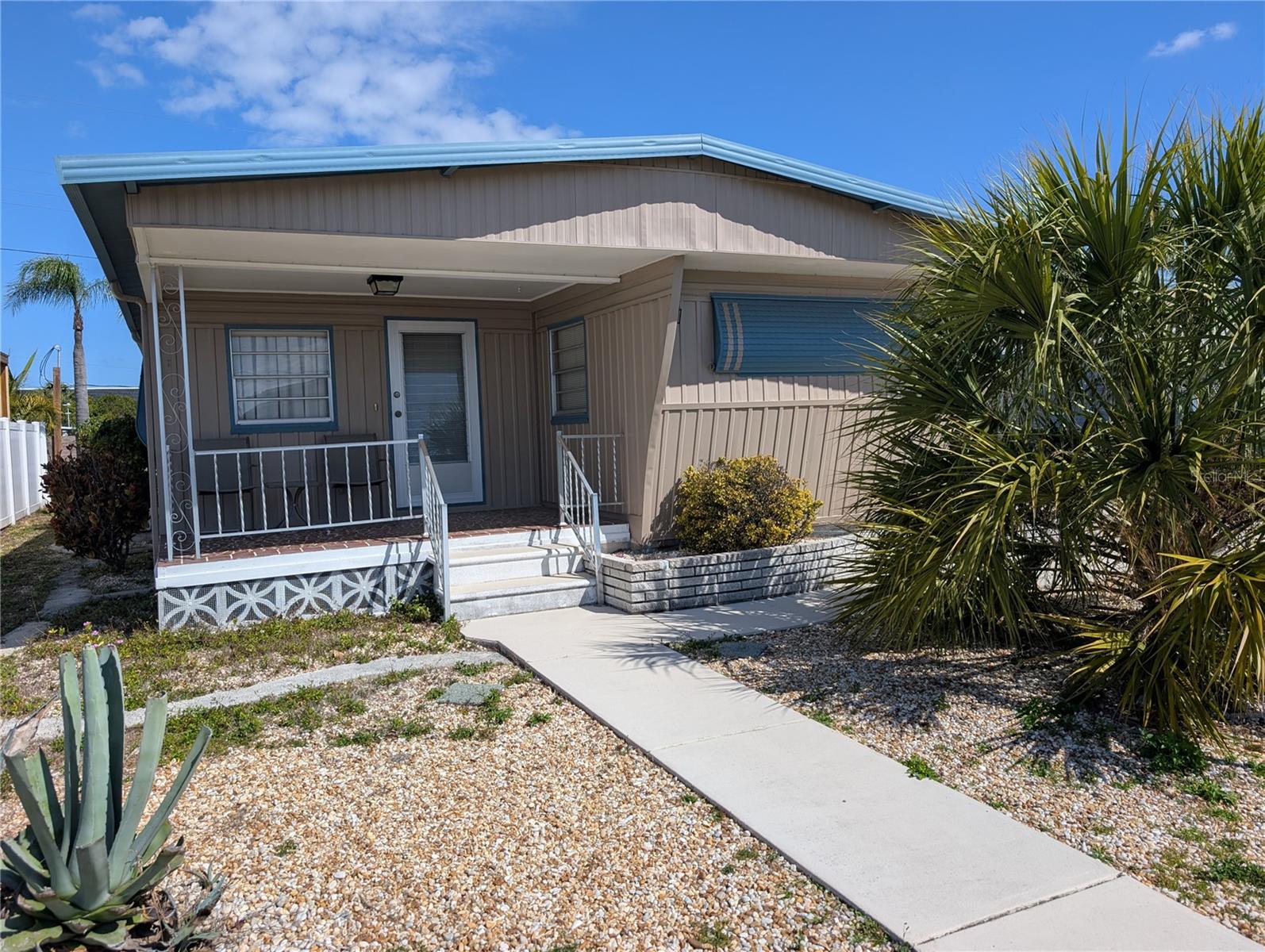 This bright, open, move-in ready home in Heather Hills Estates, a 55+ community, is a must-see! This adorable two-bedroom, two-bath home comes furnished and is ready for you to move right in. The open floor plan features a welcoming front porch—perfect for relaxing with your morning coffee or enjoying the sunset. There’s also an extended carport with inside laundry and an additional enclosed space that’s great for entertaining, reading, playing cards, or working on projects.

Major updates include a new hot water heater (2020), A/C with heat pump and thermostat (2019), washer (2025), plus an added electrical line and UV light in 2020. The electric glass cooktop was replaced in 2018, the kitchen faucet (2025), and the refrigerator in 2017.

Located in an active, pet-friendly community, this well-maintained home offers affordable living in a clean, pristine neighborhood. Best of all, you own both the home and the land—no lot rent!