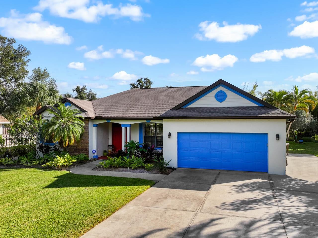 This home comes with a 13 MONTH HOME WARRANTY for buyer's Peace of Mind and to help make transitioning easier! Your private, tropical oasis awaits! Beautifully renovated 4-bed/3-bath/2-car POOL HOME tucked away in a private and sought-after neighborhood in West Bradenton and NOT in a flood zone. Minutes away from various dining options, shopping, and of course the gorgeous Florida beaches of Anna Maria Island, this home provides privacy without losing local convenience. At the end of a CUL-DE-SAC, find a long driveway and even a PARKING PAD with 220V electric: perfect space for RV or Boat Parking! Covered FRONT PORCH as well as an extraordinary and freshly painted COVERED/SCREENED LANAI leading into the backyard lagoon-style SALTWATER POOL & SPA with rock features, freshly painted deck, and even a waterfall! Lush tropical landscaping throughout this OVER HALF ACRE LOT, a fire pit area, potting bench with raised garden, and even a personal ZEN GARDEN POND with flowing water feature for ultimate relaxation. Choose one of the sitting areas on the CANAL that runs behind to enjoy wildlife watching, or pass time in the butterfly garden - there's no shortage of outdoor enjoyment in this paradise. Interior features abound as well: PLANTATION SHUTTERS, CROWN MOLDING, GRANITE COUNTERTOPS, CENTRAL VAC, and POCKET DOORS throughout for added privacy when desired. NO CARPET to contend with here: wood flooring in bedrooms, ceramic tile in bathrooms, and newer wood-look luxury vinyl plank in the common areas! The SPLIT-BEDROOM layout of this home is perfect for entertaining short or long-term guests without ever feeling crowded. The foyer opens into a traditional living room, which also accesses the formal dining room on into the completely UPDATED KITCHEN: pendant lights, undermount lighting, stainless steel appliances, large island, breakfast bar, wall oven with separate cooktop, and extensive storage. The kitchen opens into the Great Room with a breakfast nook/dinette on into the Family Room, marked by the gorgeous WOOD-BURNING FIREPLACE with stone facade and the custom build-in serving as entertainment center. The Primary Bedroom features DUAL WALK-IN CLOSETS with cedar wood interior and an EN-SUITE BATHROOM complete with linen closet, dual-sink vanity, walk-in shower, and water closet. All secondary bedrooms can be closed off from the Great Room with pocket doors and include additional storage space above each closet. The fourth bedroom has its own EN-SUITE BATH! This bathroom has a dual-sink vanity, then a pocket door leading to what doubles as the POOL BATH with single-sink vanity and shower stall. This bathroom connects to the lanai so there's no need to track water into the house during pool days! The neighborhood's original developer is still a current resident, reflecting the pride and care invested in this meticulously maintained community. Best of all, this home's proximity to both downtown Bradenton and the world-famous beaches on Anna Maria Island makes for the perfect blend of privacy, style, and coastal convenience. This home is truly something special. It's equipped to be the ultimate gathering place and tranquil respite all in one. It's a rare find that you don't want to miss!