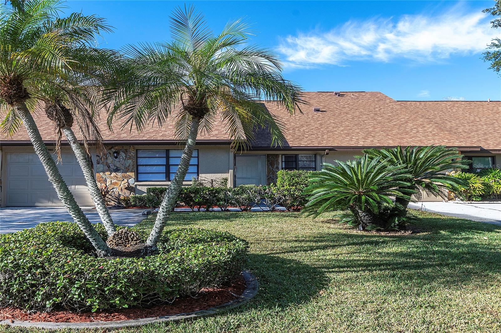 Welcome home to this fantastic waterfront 2- bedroom 2-bathroom 1-car garage villa in Lake Seminole Village. This residence sits on a nice sized lot and is located on a street with sidewalks and streetlights. Step inside and fall in love with this light and bright gem, it features vaulted ceilings in the living room, a wood burning fireplace, eating space in the kitchen, a separate Florida room and the large master bedroom is nicely appointed with its own private bathroom and a walk-in closet.  Updates to this home include the gourmet kitchen featuring all wood cabinetry, stainless steel appliances and stone counter tops, new tile and vinyl flooring throughout, crown molding and trim and both bathrooms have been completely remodeled. The association covers the roof, and it was done approximately 6 years ago, and the A/C is in top shape! Step out back and see where this home really shines, there is a water view with limited access to Lake Seminole. The rear yard is a true Florida tropical paradise. Lake Seminole village is an excellent run community, the association covers the lawn, exterior painting and the roofs and there is a beautiful community pool! This unit must be seen in person to truly appreciate the quality and craftsmanship, it is absolutely stunning, Hurry do not miss this one! THE STRUCTURE IS LOCATED IN FLOOD ZONE X  (NOT A FLOOD ZONE) REAR PORTION OF LOT IS IN A FLOOD ZONE.