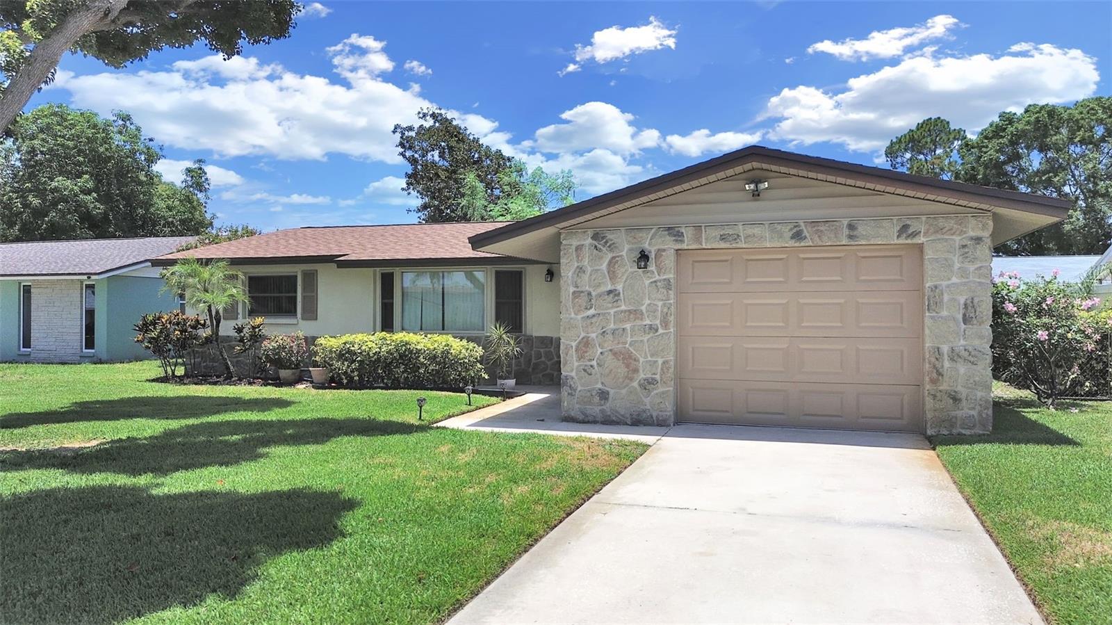 Seminole 3/2 1047 Sq. Ft. block home close to Seminole City Center and minutes to the Gulf beaches. Vinyl wood look flooring throughout.  New Roof in 2021, New HVAC duct work in 2025, Irrigation well and irrigation system, Propane Water Heater and Furnace, Newer vinyl double pane windows.  Washer Dryer area is located just outside the kitchen door in the one car garage.  Nicely landscaped and room for a pool.  This affordable family home has been well maintained and is ready for updating. Perfect starter home, excellent home for those looking to downsize or retire to. Conveniently close to shopping, dining, and entertainment. Minutes to the interstate and within an hour of two major airports.