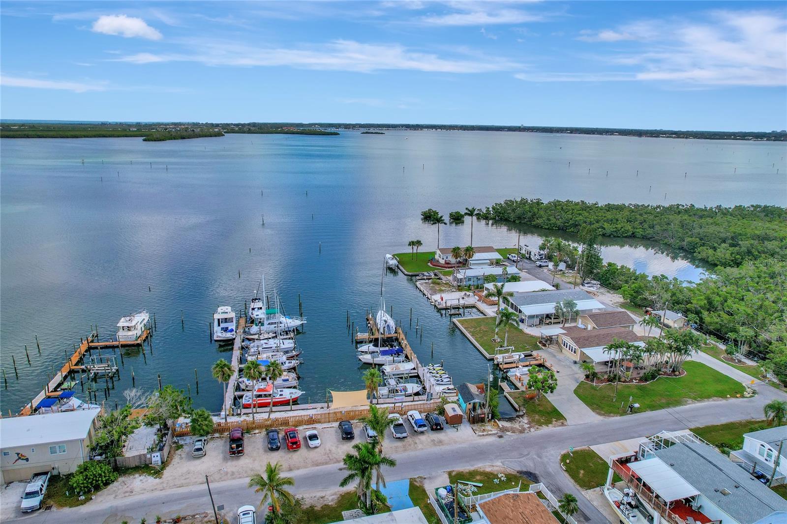 $5,000 BUYER CREDIT OF CHOICE WITH EXECUTED CONTRACT! Investor Alert - Prime Opportunity Near Anna Maria Island! Calling all savvy real estate investors - Here is your chance to OWN LAND in the sought-after SUNNY SHORES community of Bradenton, just minutes from the turquoise waters of Anna Maria Island. Located right off Palma Sola Bay, with Sunny Shores Park and the Parrot Cove Marina boat ramp in your backyard, this property is all about location, flexibility, and potential. This fully remediated over 1,400 sq ft home offers a solid foundation for your next investment project, featuring: Two additional enclosed living areas for added versatility, a NEW Shingle Roof (2025), a NEW A/C (2025), NEW Electrical (2025), home Raised and Insulated (2025), a spacious layout with significant square footage and generous closet spaces. With no rental restrictions and an optional $100/year HOA, you can create your ideal income property or personal Florida getaway. Bring your vision to life by customizing the finishes, adding your style, and maximizing returns in a high-demand coastal market! Sunny Shores is an active, golf-cart-friendly community with social amenities including a clubhouse, fitness center, library, and pool table. The boating lifestyle and sandy beaches are just minutes away, making this an ideal opportunity for long-term rental, seasonal stays, or a profitable vacation property. Invest in Florida living, personalize it your way, and watch your investment grow! Average annual rental income ranges between $2,000 – $2,500. Short-term rental opportunities are available through platforms like Airbnb and VRBO.
