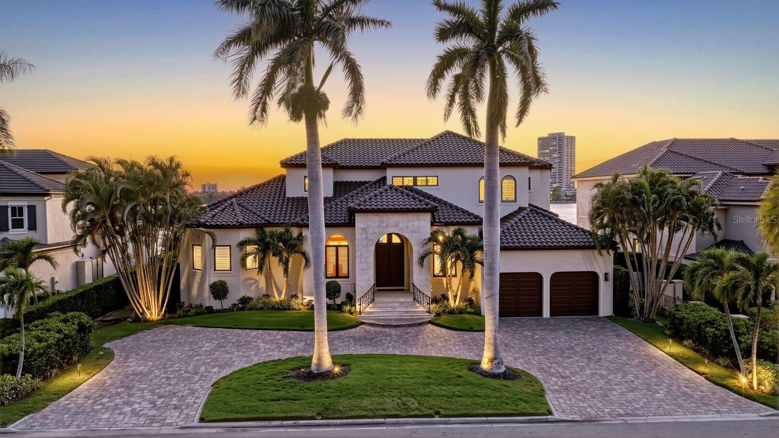Open bay sunsets, deep water access, and timeless coastal architecture define this exceptional Bird Key waterfront residence.

Positioned on a quiet cul-de-sac along Sarasota Bay, this extensively updated bayfront home offers panoramic open water views, refined living spaces, and direct Gulf access with no fixed bridges. With approximately 100 feet of waterfront frontage and a new dock completed in 2023 accommodating up to a 60-foot vessel, the property is ideally suited for both motor yachts and sailboats while embracing Sarasota’s boating lifestyle.

Inside, the residence balances warmth and scale with expansive living spaces, detailed millwork, and a thoughtful floor plan designed for both everyday comfort and entertaining. Beautiful renovations throughout have created a move-in ready environment, including a completely remodeled primary bedroom and bath, a full kitchen renovation in 2023 featuring Sub-Zero and Viking appliances, updated second-floor bathrooms, redesigned TV room with custom fireplace and cabinetry, and a temperature-controlled 140-bottle wine wall and bar installation.

Walls of hurricane-rated Pella windows and sliding doors frame open bay views while allowing natural light to move throughout the interiors. Marble, wood, and carpeted flooring, custom cabinetry, wood-paneled accents, and integrated audio systems contribute to the home’s tailored yet inviting atmosphere. Additional upgrades include a replaced seawall, resealed and painted roof, fresh exterior paint, replaced garage doors, sealed driveway, instantaneous hot water system, and updated air conditioning systems.

Outdoor living is centered around sweeping sunset views, expansive waterfront terraces, and the privacy of a generously sized homesite within Bird Key. Residents enjoy immediate access to downtown Sarasota, St. Armands Circle, Lido Beach, Bird Key Yacht Club, and the area’s renowned dining, shopping, and cultural attractions while returning home to the quiet character of this residential island community.

A beautifully maintained bayfront residence offering exceptional boating access, open water views, and a location that remains one of Sarasota’s most desirable waterfront settings. Private showings available by appointment.