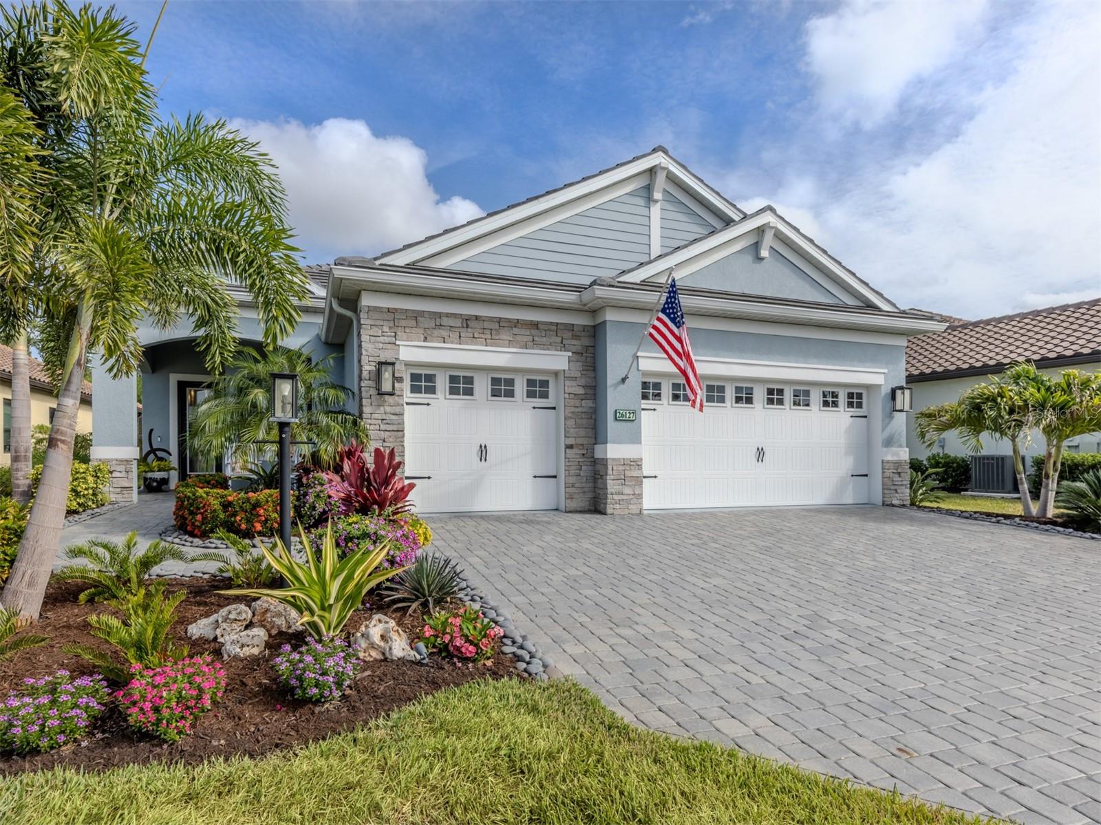 Elegant coastal, contemporary living in Boca Royale, this Sea Mist model has wow factor from every room. As you approach the paver pathway, you will appreciate the professionally designed landscaping and decorative stones leading to the hurricane-impact-resistant front door. Come on into a home that could be in Architectural Digest, Southern Living, Coastal Living and every respectable professional decorating resource; this home exudes class and a bit of whimsy. The Sea Mist has a great open floor plan, so it's easy to entertain. The gathering place in this home is around an oversized, custom woodwork island. The pantry closet has fabulous custom cabinetry and marble countertops. The Sea Mist primary bedroom has ceiling beams, designer lighting, crown molding and custom closets. The two guest bedrooms are joined by a Jack-and-Jill bath, making it a great suite for those out-of-town guests. There are plantation shutters throughout the home, upscale designer lighting at every turn, and ceiling fans throughout, including the lanai. Go out to the lanai, a tranquil, private, peaceful oasis to enjoy the wildlife, a sunset and a gorgeous pool. This home has a whole-house generator and Storm Smart screens for peace of mind. Enjoy dining alfresco with your beautiful summer kitchen; keep it cool and shaded with the custom, motorized, remote-controlled, privacy sun shades as well as maintain a little cooler temperature outside. Boca Royale is as good as being on an exotic vacation in your own backyard. There are activities for everyone, from pickleball, tennis, golf, fine dining or a casual gathering around the newly remodeled clubhouse. The lifestyle is ideal if you are looking for a fun place to live. The beaches at Manasota Key are close by, there is shopping on Dearborn Street, there is a farmers market once a week, and there is health care. The Boca Royale Golf and Country Club offers 18 holes of championship golf on a newly designed 71-par course; membership is optional. There is a wonderful state-of-the-art fitness center, and it is included in your HOA as well as your social membership to the club. At Boca Royale you are purchasing a lifestyle and this home at 26127 Norman will be a lifestyle you will enjoy coming home to. Don't wait to build when you can own a masterpiece!