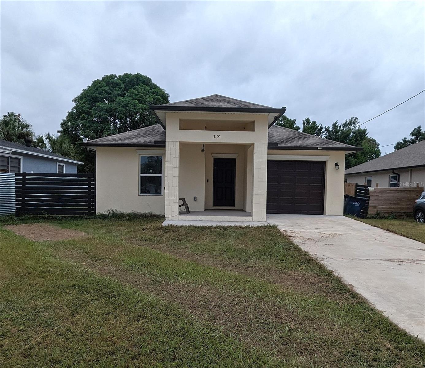 This stunning 3-bedroom, 2-bathroom home with modern design was built in 2021 and has had only one owner. Decorated in tasteful, neutral décor it will be easy to see how you can make this home your own.

As you step inside, you'll be greeted by an open floorplan that is perfect for entertaining or simply relaxing with your loved ones. The beautiful yet durable luxury vinyl flooring is continuous throughout the property. The kitchen is a chef's dream, featuring granite countertops, kitchen cabinets adorned with crown molding and a built-in wine rack, stainless steel appliances and a separate food pantry. Prepare delicious meals while enjoying the company of family and friends at the breakfast bar or in the adjacent dining and living areas.
 
The primary suite is a retreat, complete with a spacious bedroom, tray ceiling and a walk-in closet, providing plenty of storage space for your wardrobe. The attached bathroom is a luxurious haven, boasting a large walk-in shower with frameless shower enclosure and custom tile work, creating a spa-like atmosphere.  The secondary bathroom offers a tub-shower combo with more beautiful tile and is conveniently located between the other bedrooms and adjacent to the main living area. This bright bathroom features a window to bring in the natural light.

One of the highlights of this property is the fully fenced yard, providing privacy and security for outdoor activities. Step outside through the living room slider and find yourself on a raised patio, perfect for enjoying the beautiful weather and hosting gatherings. You'll also find a delightful banana tree, adding a touch of tropical charm to the backyard.  Additional features of this home include an attached garage with durable epoxy flooring and in the hallway, not one but two linen closets providing plenty of storage space. The laundry is centrally located inside the home with washer /dryer included. The seller is willing to include the furniture with the right offer.

Located in Tampa, this home offers easy access to nearby amenities such as parks, shopping centers, restaurants, and major transportation routes, ensuring a convenient and enjoyable lifestyle. Don't miss the opportunity to make this your new home. Experience the elegance and modern features of this newer built residence without waiting a year for a new home to be built. Contact us now to schedule a viewing and start envisioning your future in this beautiful home!
