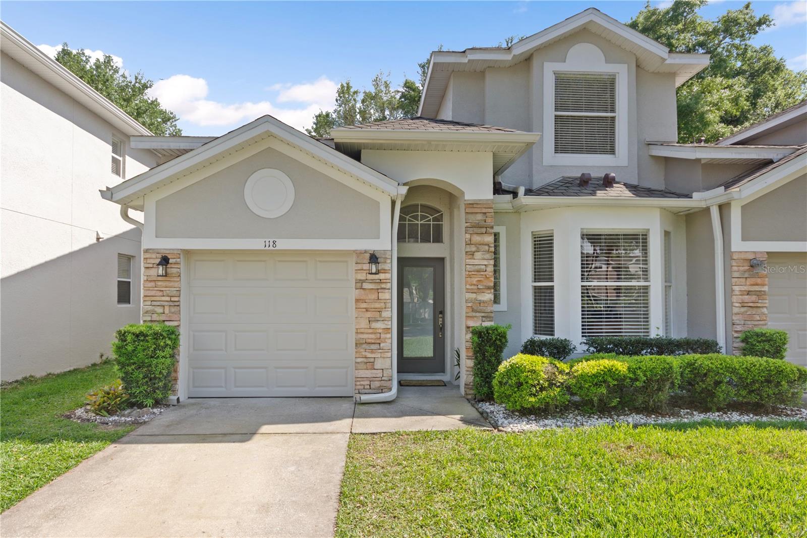 OVIEDO Townhome- Located in the gated community of Biltmore Townhomes near Oviedo High School, across the street from grocery store plaza and just minutes from Oviedo on the Park for restaurants & shopping. This Bright & Open layout 3 bed/ 2.5 Bath/ 1 car townhome features- Primary Bedroom & Bathroom on the FIRST FLOOR, two additional bedrooms with shared full bathroom on the SECOND FLOOR. Modern Features include: Interior creamy white paint all throughout, oversized custom ceramic tile lead from the front entry and welcoming you into the kitchen featuring: 42” Arctic Mist Cabinets, NEW Quartz, Stainless Steel Appliances, pantry/ laundry space combo and a breakfast nook for seating overlooking the front yard. Luxury Vinyl Wood Plank align the Dining Room into the Family Room with Cathedral ceilings. Plus, there’s a covered screened patio to enjoy your coffee in the mornings, quiet reading time or even gardening. The Primary Bedroom features LVP flooring and overlooks into the serene backyard. Primary Bathroom includes Dual Sinks and Walk-in Shower.  Carpet aligns the stairs and the entire upstairs into the secondary bedrooms. Blinds on all windows. Room for one car or storage in the garage and the driveway is long enough to fit two cars (no overnight street parking allowed.) Walk across the street to the community pool and clubhouse. Nearby is UCF, close to SR 434 or Red Bug Lk Rd for access to Hwy 417. Plus, peace of mind, the roof was replaced in 2022. Small pets are welcome- dogs under 35 lbs.