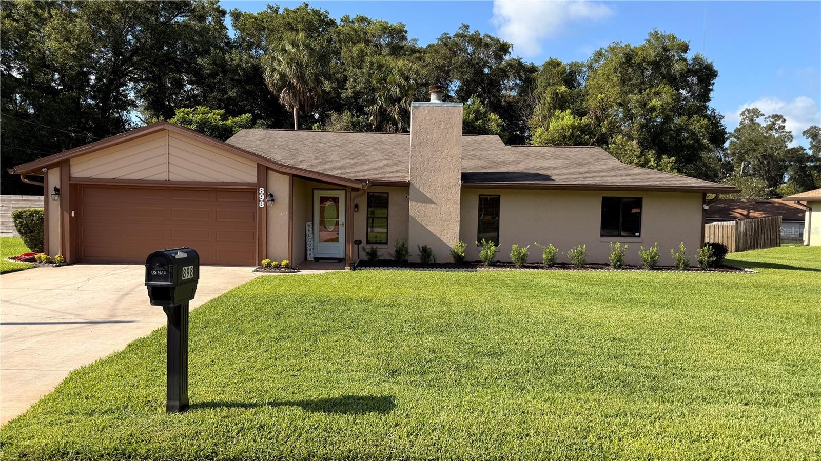 Move-in ready and meticulously maintained! This beautiful concrete block home with cedar trim shows like a model and reflects true pride of ownership. Freshly painted inside, it features laminate flooring throughout the living areas, tile in the wet areas, and an inviting living room with a cozy wood-burning fireplace.

The kitchen offers wood cabinetry, Corian countertops, and a full suite of stainless steel appliances, including the range, microwave, dishwasher, and refrigerator. The spacious primary suite features an en-suite bath with a relaxing jetted soaking tub.

Recent updates include a new roof and HVAC (2018), added attic insulation to R-38 for improved energy efficiency, and a 12' x 12' rear deck (2023) perfect for entertaining or relaxing outdoors. The beautifully landscaped yard is equipped with an irrigation system for easy maintenance.

This exceptionally clean, move-in-ready home offers quality construction, thoughtful updates, and lasting value. Don't miss your opportunity to make it yours—schedule your private showing today!

Property is under video/audio surveillance.