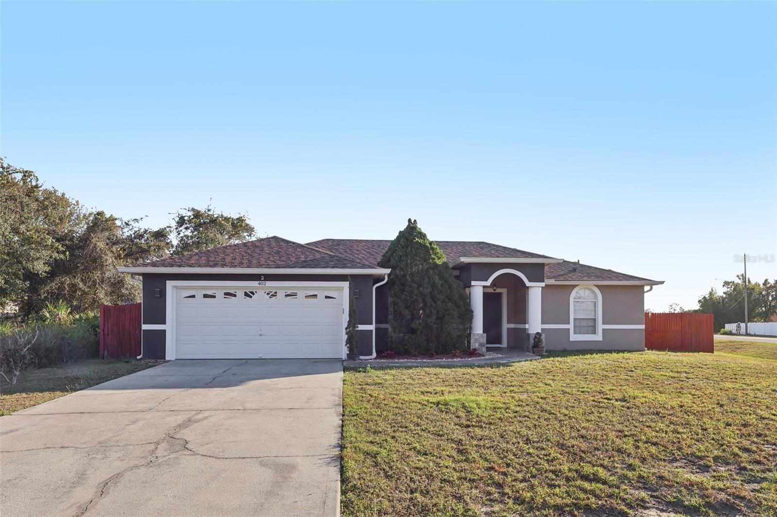 Stunning Pool Home with Paid-Off Solar – A Rare Opportunity in Poinciana! Welcome to 402 Ohio Way, a beautifully maintained and extensively upgraded 3-bedroom, 2-bathroom pool home offering nearly 1,600 square feet of comfortable living space on a spacious corner lot. This move-in-ready property combines modern upgrades, energy efficiency, and the Florida lifestyle buyers are searching for.

From the moment you arrive, you'll appreciate the pride of ownership and attention to detail throughout. Inside, you'll find a bright and inviting floor plan featuring remodeled bathrooms, spacious living areas, and a layout designed for both everyday living and entertaining. Major improvements have already been completed, including a newer roof, new HVAC system, tankless water heater, security camera system, and a full gutter system for added protection and peace of mind.

One of the most impressive features of this home is the fully paid-off $53,000 solar panel system, which will be transferred to the new owner at closing. Enjoy significant energy savings for years to come while benefiting from a more efficient and environmentally friendly home.

Step outside and discover what truly sets this property apart. The private backyard oasis features a beautiful oversized swimming pool and an expansive outdoor space perfect for weekend gatherings, family fun, or simply relaxing under the Florida sun. With only a very limited number of pool homes currently available in the area, and with this property offering one of the larger and more attractive pools on the market, opportunities like this do not come around often.

Whether you're looking for a primary residence, vacation home, or investment property, this home checks all the boxes. Conveniently located near schools, shopping, dining, medical facilities, and major roadways, you'll enjoy both comfort and convenience in one exceptional package.

Don't miss your chance to own one of the most desirable pool homes currently available in the area. Schedule your private showing today and experience everything this remarkable property has to offer.