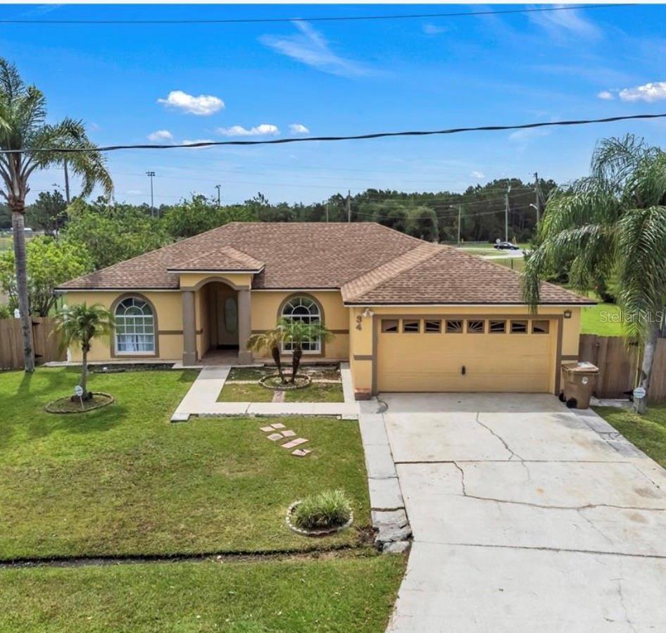 Welcome Home to 34 Bradford Court! Nestled on a generous 0.41-acre cul-de-sac lot in the heart of Poinciana, this charming 3-bedroom, 2-bathroom single-family home with bright, functional living space. Step inside to find soaring vaulted ceilings, a desirable split-bedroom floor plan, and sleek ceramic tile flooring throughout—no carpet here! The spacious kitchen flows seamlessly into the main living areas, making entertaining a breeze. Outside, enjoy ultimate privacy in your massive, fully fenced backyard, complete with a convenient rear storage shed. Plus, the low HOA fee covers your cable TV and high-speed internet! Don't miss this perfect blend of comfort, space, and convenience. +1 Option 2: Bulleted & Easy to Scan (Best for quick reading) Charming Move-In Ready
