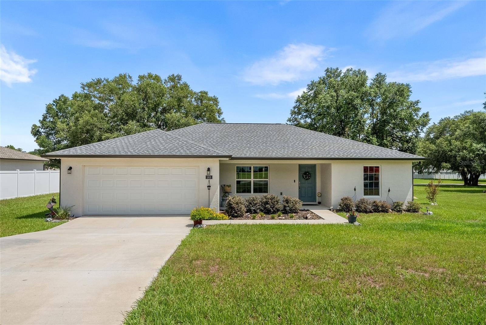 Welcome to Citra Highlands, a peaceful community surrounded by scenic horse farms and quiet country living. Conveniently located along NE Jacksonville Road, this home offers easy access to both Ocala and Gainesville while still providing a relaxing escape from the city. The popular Oak floor plan features soaring cathedral ceilings, an open great room and kitchen layout, and an impressive 9 foot 8 inch bar top that is perfect for entertaining. Enjoy additional outdoor living space on the newly added and extended screened-in porch. The home also includes a 2-10 Home Buyers Warranty for added peace of mind. With a spacious design, inviting atmosphere, and great value, this home is ready for its next owner.