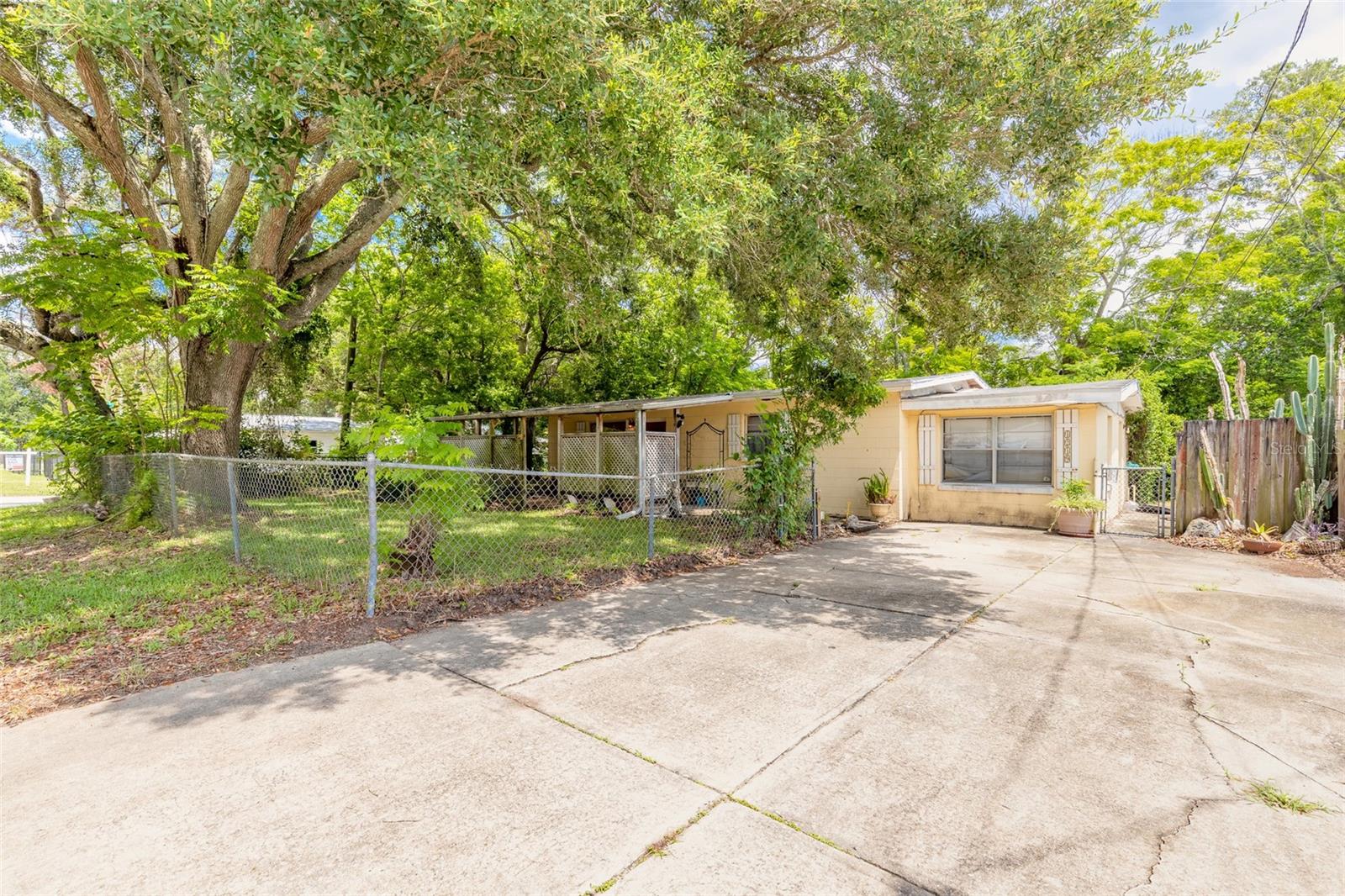 Opportunity is knocking at the corner of Leon Avenue. This 3-bedroom, 1-bath open floorplan home offers plenty of potential for an investor or buyer ready to bring new life to an existing property. Situated on a spacious corner lot, the home features a converted garage currently used as a third bedroom (county records reflect a 2-bedroom home) with large 9' x 4.5' closet, back door leading to yard, inside utility room, a covered front porch, mature shade trees, and a detached storage shed in the fenced backyard, providing additional space for tools, hobbies, or equipment. Inside this concrete block home, you'll find a flexible layout ready for renovation and customization. The property's established footprint offers a solid starting point for your next project. House is currently serviced by well and septic system. Conveniently located near shopping, dining, schools, major roadways, and just a short drive to Daytona's beaches and attractions. Property is being sold As-Is. Cash offers only. Personal items do NOT convey. Buyer is responsible for verifying all information deemed important, including room count, square footage, zoning, permitting, and intended use.
