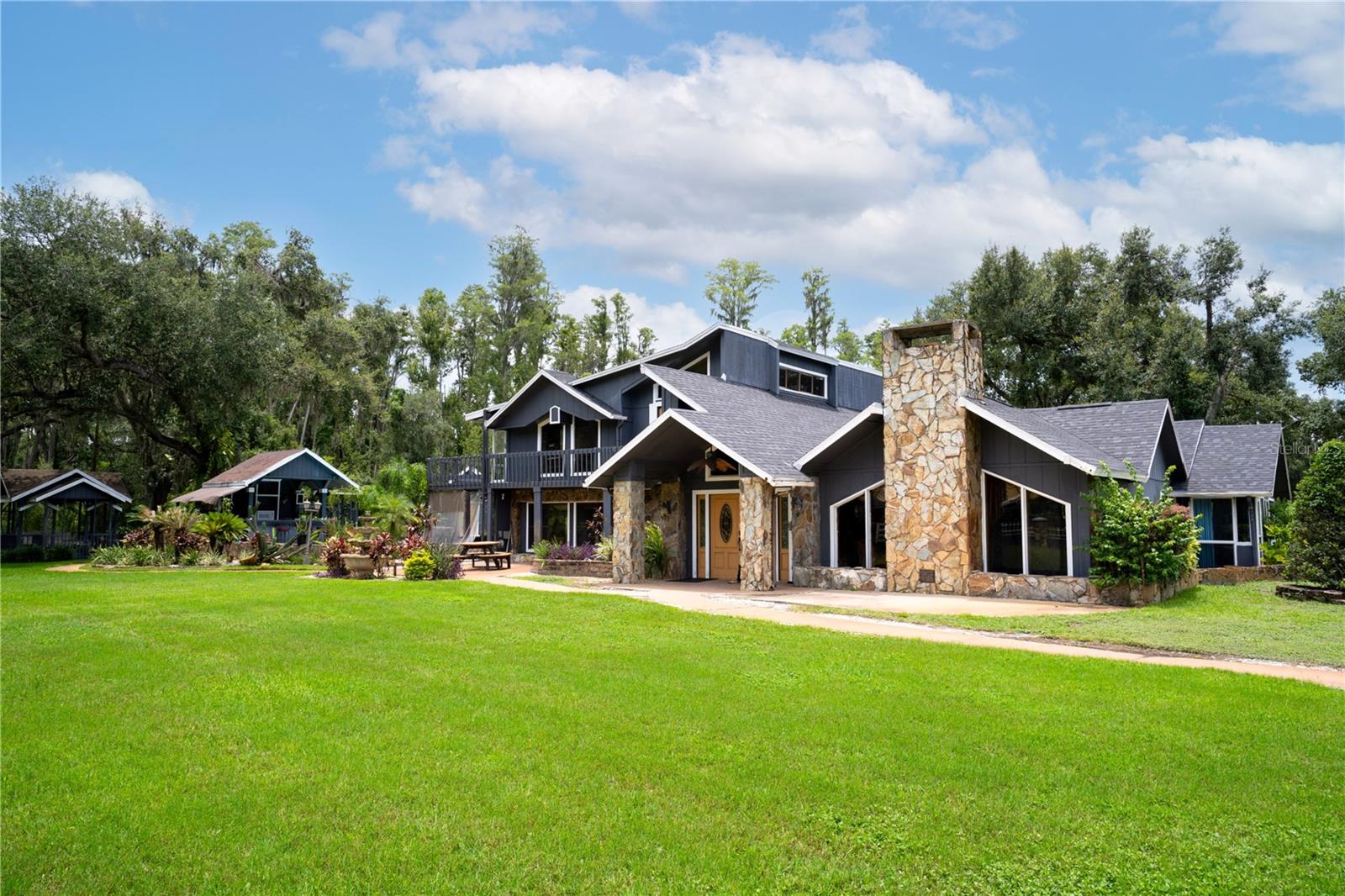 *** Owner wants $900,000, will accept the remainder in owner financing.*** A Rare Multi-Residence Estate with Unlimited Possibilities in Beautiful Plant City, Florida! Tucked away on nearly two private, peaceful acres, this one-of-a-kind estate features four separate buildings and five fully independent living units, each with their own kitchen and laundry. The Main home is 6 Bedrooms, 5 baths. The Second Home has is comprised of two homes; a 3 Bedroom 1 Bath, and a 1 Bedroom, one Bath. The third Home is a 1 Bedroom, 1 Bath. The Fourth Home is a 3 Bedroom, 1 Bathroom, over a office with a bathroom. ALMOST UNLIMITED PARKING. Whether you're seeking a serene family retreat, a business home combination or a high-performing investment, this property offers flexibility, scale, and lifestyle all in one. All furniture except the office is included! Multigenerational Living: Ideal for large or blended families wanting space, separation, and long-term comfort across multiple homes. Group Home or Residential Facility: Perfectly suited for assisted living, transitional housing, or other care-related services — with multiple private entrances, 5 full kitchens, and abundant common areas.  At the heart of the estate is the main residence, surrounded by mature trees, swaying palms, and an ambiance of tropical tranquility. The resort-style pool area is pure Florida living: A sparkling pool surrounded by tropical landscaping A standalone pool house bath, outdoor kitchen, and bar area for effortless entertaining A bubbling hot tub beneath the stars A playground and gazebo nestled in a quiet corner of the property — perfect for relaxing afternoons or joyful gatherings This property isn’t just unique — it’s inspiring. Peaceful, private, and full of possibilities, it’s a rare opportunity to own a multi-unit Florida estate that’s just as suited for quiet luxury living as it is for business and investment. Schedule your private tour and experience the beauty, versatility, and potential of this incredible property today. OR....Shared Living or Co-Living Model: The layout could be increased up to 24 bedrooms+ and includes 10.5 bathrooms (including a dedicated poolside half-bath), creating massive income potential. The high bathroom count allows for private or semi-private setups, boosting rental value and tenant satisfaction in a room-by-room business model. Airbnb or Short-Term Rental Compound: Already functioning as a vacation rental, this estate is ready to be elevated to a premier income-producing destination with five rentable units — all on one lush Florida property.
** All Information Is Deemed Accurate - Buyer To Verify information and all zoning and permitting **
