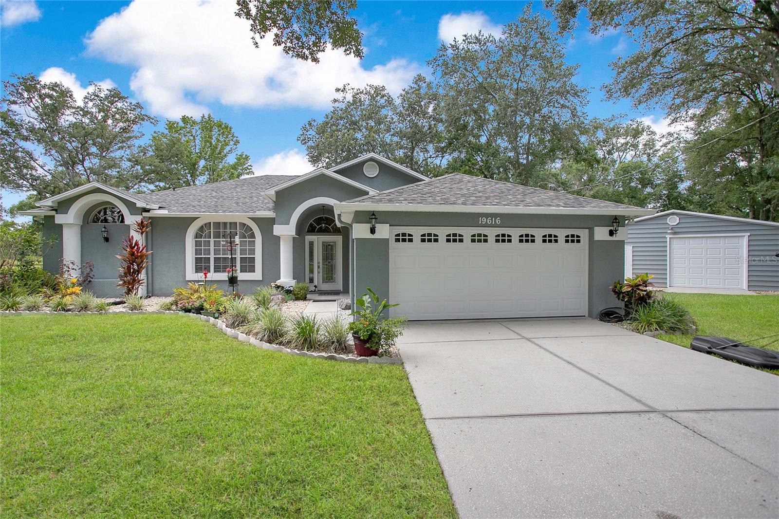 Rare opportunity to own a 4.83± acre residential estate in the highly desirable Lutz area. This 4-bedroom, 2-bath home offers approximately 1,825 heated square feet and is situated on a spacious parcel providing privacy, room to expand, and a variety of potential uses. The property features public water service, mature landscaping, and convenient access to major roadways, shopping, dining, and top-rated schools. Whether you're looking for a private homestead, investment opportunity, or future development potential, this unique property offers exceptional value in a rapidly growing area of Hillsborough County.