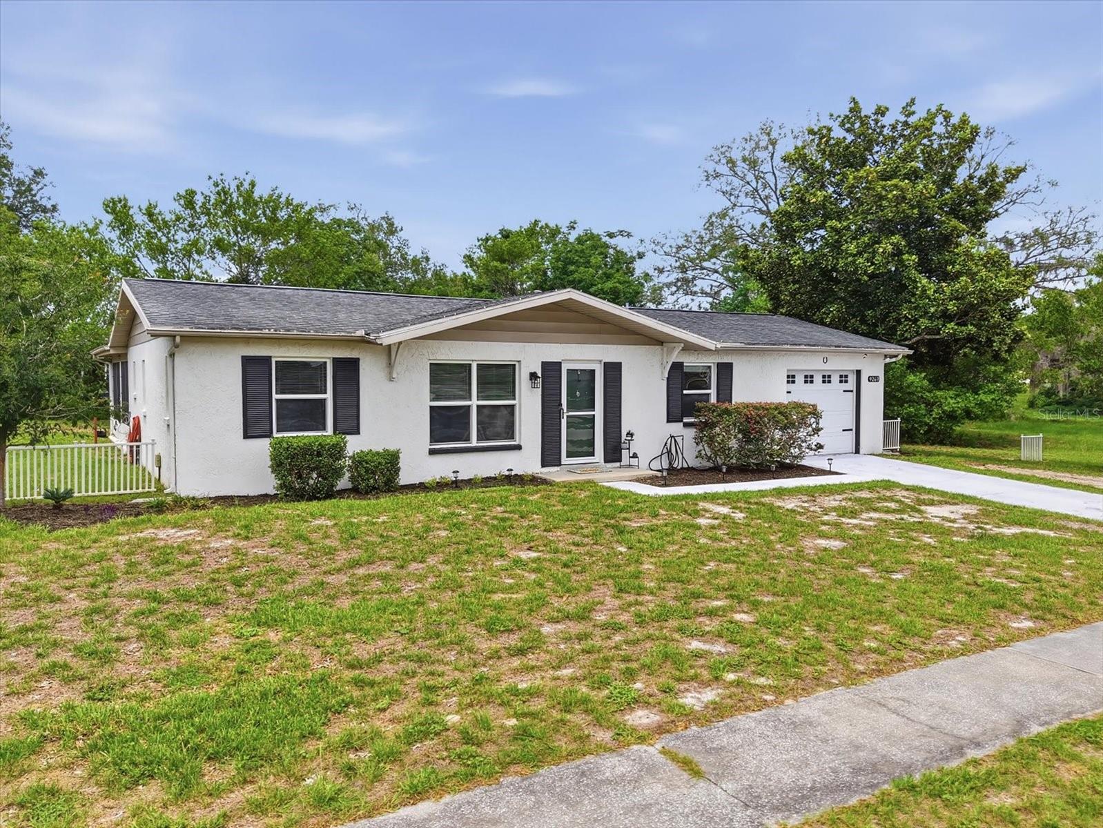 **Preferred Lender is offering 1 year of 1 percent lower interest rate paid by lender!** NO HOA - NO CDD - NO REQUIRED FLOOD INSURANCE - NEWER WINDOWS - NEW AC - NEW ELECTRICAL PANEL- LOW UTILITY BILLS Welcome to 9269 Marler Road, where thoughtful updates, flexible living space, and Florida outdoor living come together in a home that offers both charm and peace of mind.

Located in an X flood zone with no required flood insurance, no HOA, and no CDD fees, this beautifully maintained property provides the freedom and affordability that many buyers are looking for.

Inside, you'll find water-resistant laminate flooring, crown molding, 5.25-inch baseboards, updated lighting and ceiling fans, built-in shelving, and custom storage throughout. The functional floor plan is enhanced by a dedicated office space off the garage, offering the flexibility needed for remote work, hobbies, fitness equipment, or a quiet retreat.

The updated kitchen features double-stacked painted cabinetry, subway tile backsplash, open shelving, stainless steel appliances, and a gas range. A charming coffee bar can remain with the home, creating the perfect spot to start your day.

The primary suite includes a stylish barn door and built-in closet storage, while both bathrooms have been tastefully updated with newer vanities, toilets, glass shower doors, and upgraded shower systems with body sprayers for a spa-like feel.

Double doors with built-in blinds lead to the covered lanai and screened outdoor living area with electrical, creating a seamless transition between indoor and outdoor spaces. The spacious backyard offers privacy, room to entertain, and plenty of space for pets, gardening, or play. The outdoor grill is directly connected to gas and will stay with the property.

Additional features include built-in closets throughout, a linen closet, inside utility room with cabinetry, washer and dryer included, blinds throughout, a one-car garage with opener and pebble-finish flooring, and newer windows that enhance energy efficiency and natural light.

Major updates provide confidence for years to come, including a newer AC system (approximately two years old), new electrical panel, roof replaced in 2013, gas water heater, and gas stove supplied by an AmeriGas tank.

Conveniently located near shopping, dining, parks, Weeki Wachee Springs, and the Gulf Coast's outdoor recreation opportunities, this move-in-ready home combines modern updates, flexible living, and everyday comfort without the added expense of HOA, CDD, or required flood insurance.