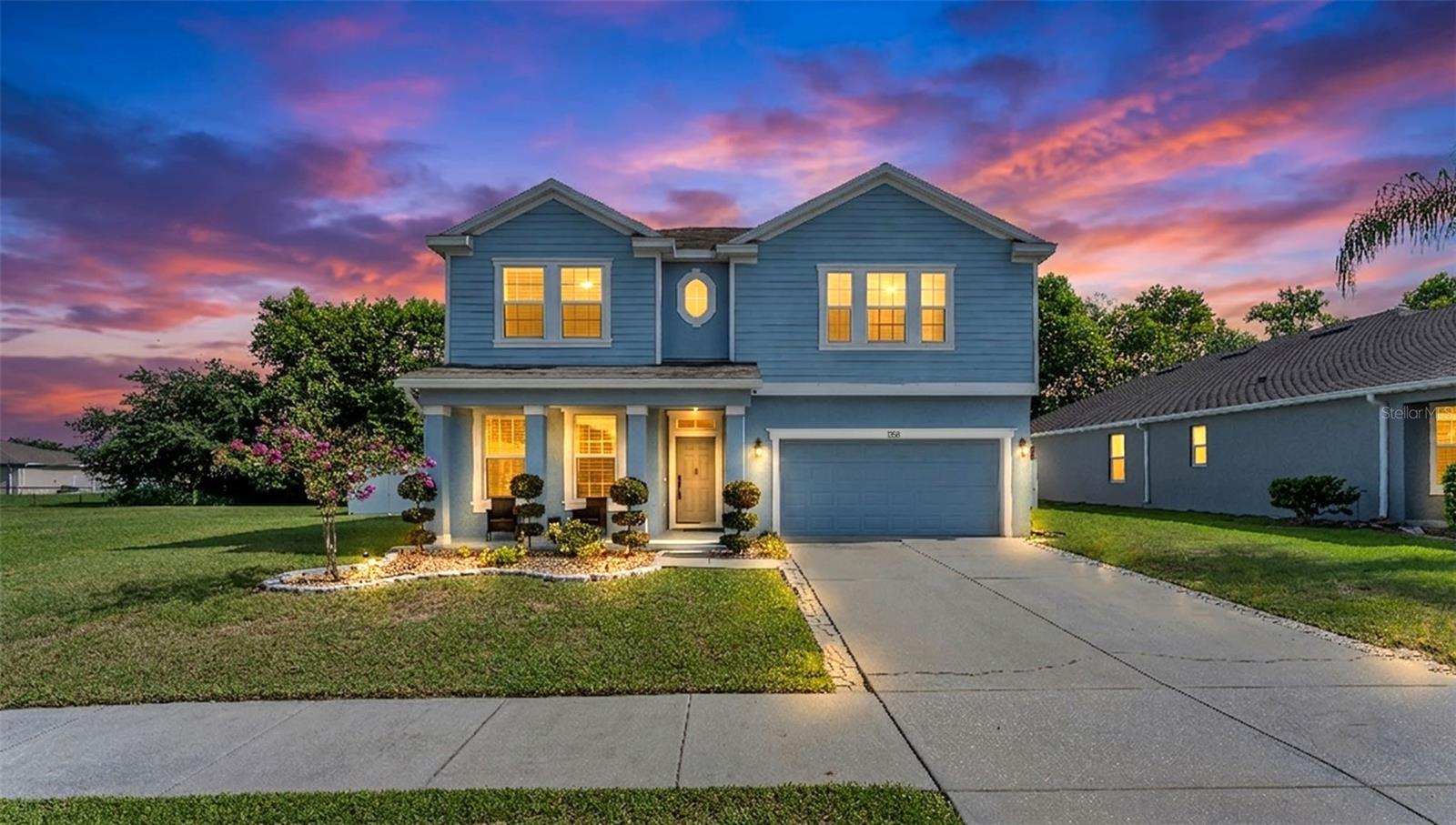 Beautiful 4 bedroom, 3 1/2 baths with over 3,000 sq ft living area in the lovely community of Berkley Reserve! You will love this home from the moment you step through the spacious entryway. Perfect for entertaining, the open floor plan features a huge kitchen, open dining room, large family room, formal living room, oversized laundry room, and upstairs bonus room. The upgraded kitchen features wood cabinets with crown moulding, granite counters, stainless steel appliances, closet pantry, butler's pantry, breakfast bar with counter seating, and large dining space adjacent. Family room is spacious and features sliding doors to the screened patio. Downstairs there is also a half bath for your guests. Your spacious primary bedroom suite is downstairs and features a huge walk in closet and glamour bathroom with a garden soaking tub, shower, two vanities with ample storage, and water closet. The upstairs rec room is so large it could be used as an upstairs media room or playroom.  The upstairs also features 3 bedrooms with walk in closets, and two full baths.  Enjoy Florida living by stepping out the back door into your private fenced backyard with No side neighbors. The house sits on a corner with an extra large side area that was designated as a community park, but not developed. Such a lovely home at a great price! Priced to Sell Quickly! Call today!