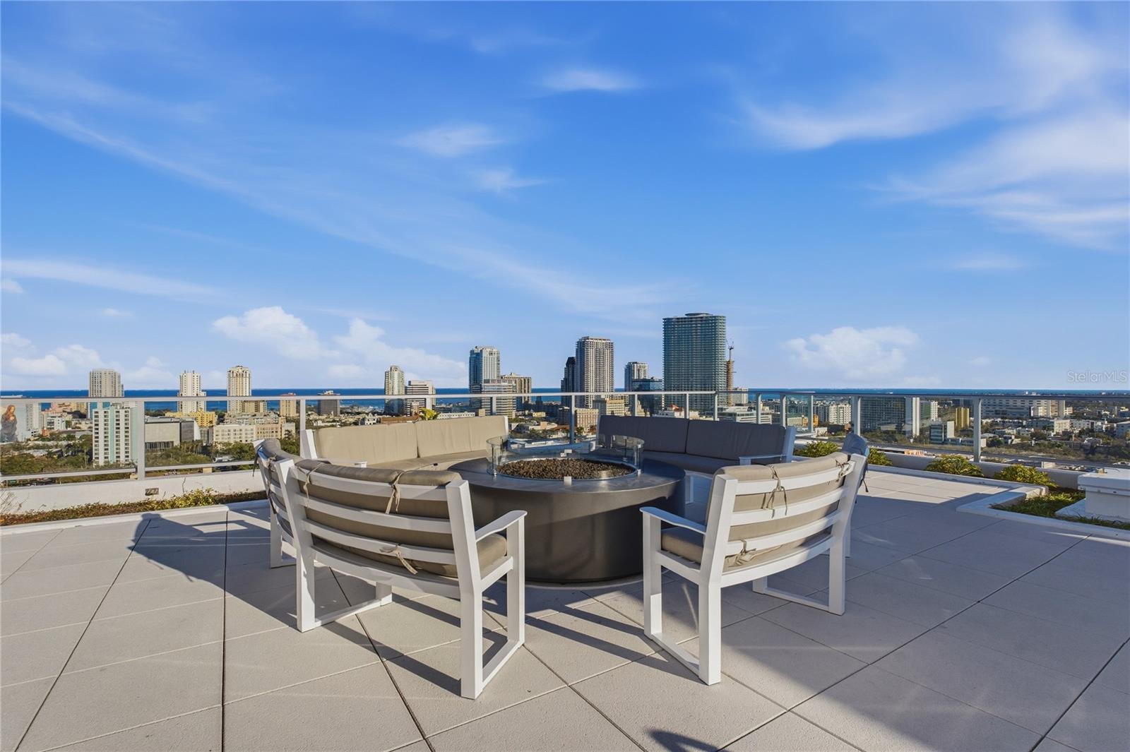 Welcome to your new rental paradise in the heart of St. Petersburg! This stunning 2-bedroom 2.5 bath condo, complete with an office/den, spans an impressive 1,931 square feet and offers a modern lifestyle combined with breathtaking views. Located in a stylish condominium tower featuring 88 spacious residences, this home is perfect for those seeking luxury and convenience. As you enter, you'll be captivated by the open floor plan, designed for effortless living and entertaining. The dramatic floor-to-ceiling windows flood the space with natural light while offering panoramic views of Mirror Lake, Downtown St. Petersburg, Tampa Bay, and the iconic Sunshine Skyway Bridge. Whether you're hosting friends or enjoying a quiet evening, the views will create a backdrop that enhances any occasion. The sleek, modern chef’s kitchen is a culinary delight, featuring a built-in oven and microwave, a frameless refrigerator with French doors, and stainless steel appliances that bring style and functionality to your cooking space. Custom cabinets and elegant tile work complete this inviting area, making meal preparation a pleasure. The spacious primary suite is a true retreat, showcases a generous walk-in closet and a luxurious bathroom equipped with a walk-in shower featuring double shower heads. Enjoy the convenience of separate vanities that provide ample space for your daily routines. The second bedroom and office/den offer flexibility for work or relaxation, allowing you to customize the space to fit your needs. Step outside onto your terrace-style balcony, where you can soak in the vibrant atmosphere of St. Petersburg. This outdoor space is perfect for sipping your morning coffee or unwinding with a glass of wine in the evening while taking in the stunning views. This exceptional condo is part of a community that offers an array of outstanding amenities. Enjoy a 12,000 square-foot rooftop amenity deck complete with a tropical oasis pool, spa, and sauna—perfect for relaxing on sunny days. Stay active in the state-of-the-art fitness center or gather with friends in the formal social room, which features an outdoor kitchen and beverage bar for entertaining. Convenience is at your fingertips with features like an enhanced elevator system, controlled access multi-level parking, a lobby coffee bar, and an onsite concierge service. The community also includes private bicycle storage and designated ride-share areas for easy transportation. Located at Mirror Lake, this condo offers easy access to the heart of St. Petersburg, where you can explore local shops, restaurants, and cultural attractions. Plus, a golf cart shuttle service makes it simple to enjoy everything downtown has to offer. Don’t miss out on this incredible opportunity to live in luxury! Schedule your viewing today and step into a lifestyle where every amenity is designed for comfort and enjoyment. Experience modern urban living at its finest!
