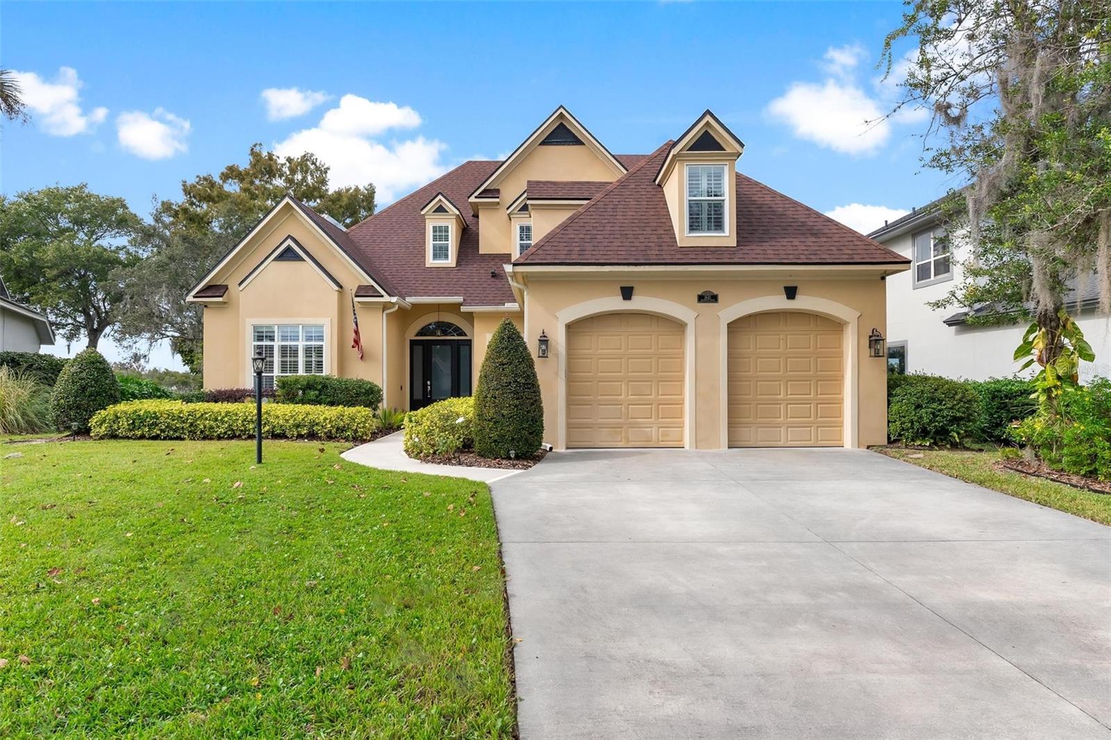 Welcome home to this spacious and inviting 4-bedroom, 3-bath residence with a flex room, ideally situated in the desirable Country Club of Mount Dora. Designed for comfort and entertaining, this home features an open floor plan with both a family room and a formal living area, providing plenty of space for gatherings and everyday living. The kitchen offers an abundance of cabinet space, bar seating, and a breakfast nook filled with natural light. The downstairs primary suite is a relaxing retreat, complete with direct access to the pool, a walk-in closet, dual sinks, a soaking tub, and a separate shower. Upstairs you'll find additional bedrooms and a full bath, perfect for guests or family. The versatile flex room can easily serve as an office, hobby space, or playroom to fit your needs. Step outside to your private backyard oasis featuring a heated, saltwater pool with a view of the tranquil waters of Loch Leven. The covered and screened patio provides plenty of space to unwind, enjoy morning coffee, or host friends while taking in the peaceful lake view. Located in one of Mount Doras most sought-after and secure communities, you'll enjoy the beautifully maintained Country Club of Mount Dora with access to golf, tennis, and a clubhouse restaurant. Downtown Mount Dora is just minutes away, offering quaint shops, local dining, and year-round festivals. This property truly offers the best of Florida living comfort, style, and a stunning setting.