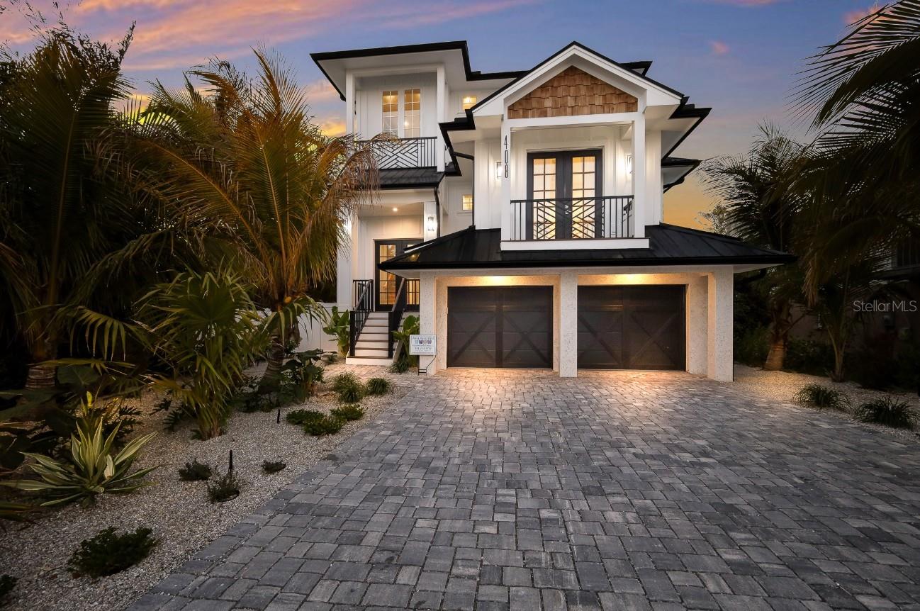 Welcome to Boundless Waves, a new, custom-built coastal estate that perfectly captures the essence of luxury island living on beautiful Anna Maria Island. This exceptional six-bedroom, six-and-a-half-bath residence spans over 3,500 square feet and was thoughtfully designed with no expense spared and no detail overlooked. Every inch of this home reflects superior craftsmanship, from the extensive custom millwork and wood trim to the refined finishes that create an atmosphere of timeless coastal elegance. The open-concept floor plan is bathed in natural light and anchored by a stunning great room with soaring ceilings, shiplap accents, and wide-plank flooring that flows seamlessly throughout. The gourmet kitchen is a showpiece of design and function, featuring professional-grade appliances, a large quartz island, custom cabinetry, and designer lighting—perfect for entertaining or gathering with family.



Each bedroom is its own private retreat, complete with an ensuite bath, custom tilework, and spa-like features. The primary suite offers a serene escape with a luxurious bathroom, dual vanities, and direct access to a private balcony. Every detail has been considered, blending modern comfort with coastal sophistication.



Outside, the home’s resort-style backyard is a true sanctuary. The sparkling pool and spa are surrounded by lush tropical landscaping and durable, low-maintenance artificial turf. A covered lanai and multiple balconies provide inviting spaces for relaxing, dining, and entertaining. Whether you’re soaking up the sun poolside or enjoying sunset views from the rooftop deck, the outdoor living experience at Boundless Waves is unmatched. This property is perfect for a vacation home or investment property. CURRENTLY A RENTAL PROPERTY WITH FORWARD BOOKINGS IN PLACE!!!



Located in the heart of Anna Maria, this home offers the perfect balance of tranquility and convenience. Stroll or bike to the beach in minutes, explore the island’s boutique shops and dining on charming Pine Avenue, or cruise to the shore in your golf cart. Boundless Waves isn’t just a home—it’s a lifestyle of relaxed luxury and effortless coastal living.