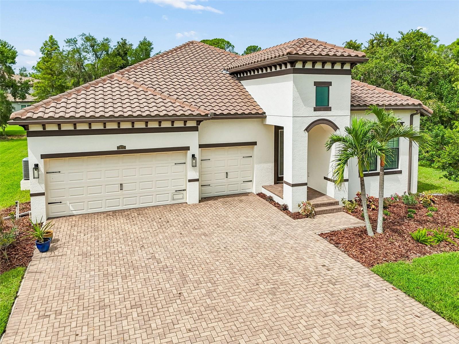 Nestled within the exclusive gated community of Marsh Pointe along the shores of Old Tampa Bay, this beautifully appointed 4-bedroom, 3-bath residence offers 2,477 square feet of refined living on an oversized homesite in one of Tampa’s most private and sought-after enclaves.
Set well back from the road and surrounded by lush preserve views, this exceptional property offers a rare combination of privacy, space, and tranquility. Rich white oak flooring flows throughout the open-concept floor plan, where spacious living and dining areas are designed for effortless entertaining and comfortable everyday living. The gorgeous kitchen at the center of the home features a substantial island with quartz counters, backsplash with an elegant coastal vibe and a sizable walk-in pantry.
The thoughtfully designed layout features four generously sized bedrooms, three full baths, and a spacious 3-car garage. The primary suite not only has beautiful windows, but 2 separate walk in closets with custom designed systems. Step outside to the screened lanai, the perfect place to enjoy morning coffee, outdoor dining, or peaceful evenings overlooking the serene preserve.
Offering the feel of a private retreat, yet just minutes from Tampa International Airport, premier shopping, dining, top-rated schools, and Gulf Coast beaches, Marsh Pointe is one of Tampa Bay’s hidden gems.