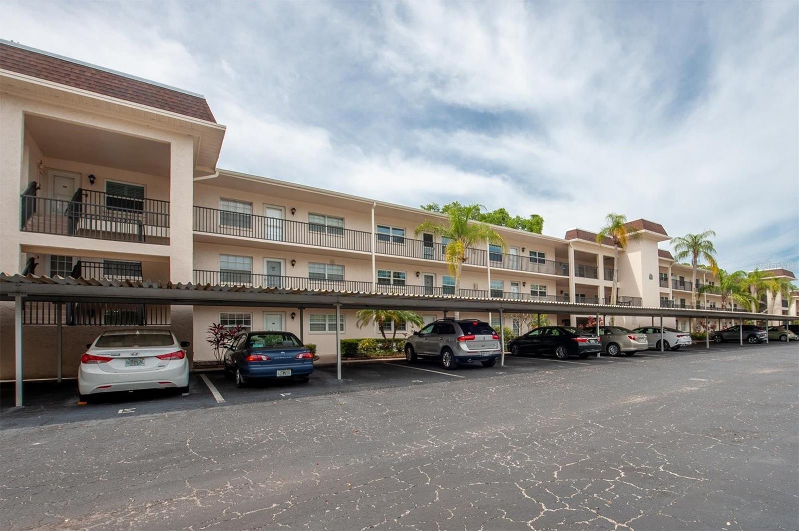 Charming Ground-Floor Condo in the Heart of Dunedin's Desirable Patricia Oaks 55+ Community. Welcome to Patricia Oaks, one of Dunedin's most sought-after 55+ communities. This ground-floor 2-bedroom, 1-bath condo offers the perfect blend of comfort, convenience, and unbeatable location - all within walking distance to downtown Dunedin with its vibrant shops, restaurants, breweries, bars and entertainment. This spacious unit features an open floor plan, a large primary bedroom with two closets, and a screened-in lanai perfect for enjoying Florida's beautiful weather.  Recent updates include a new A/C, new water heater, and hurricane-resistant sliding glass doors and windows for added peace of mind. The unit also comes with a covered carport conveniently located just outside your front door. The HOA fee includes water, trash, cable, internet and access to the community pool and clubhouse, making for easy, low-maintenance living.  Enjoy being just 10 minutes from Honeymoon Island Beach, the Dunedin Marina, TD Ballpark (home of the Blue Jays spring training), the Pinellas Trail and all the charm that makes Dunedin one of Florida's most beloved coastal towns and tourist destinations. Leasing is permitted with a 4-month minimum lease term; however, owners must reside in the unit for 2 years prior to leasing.