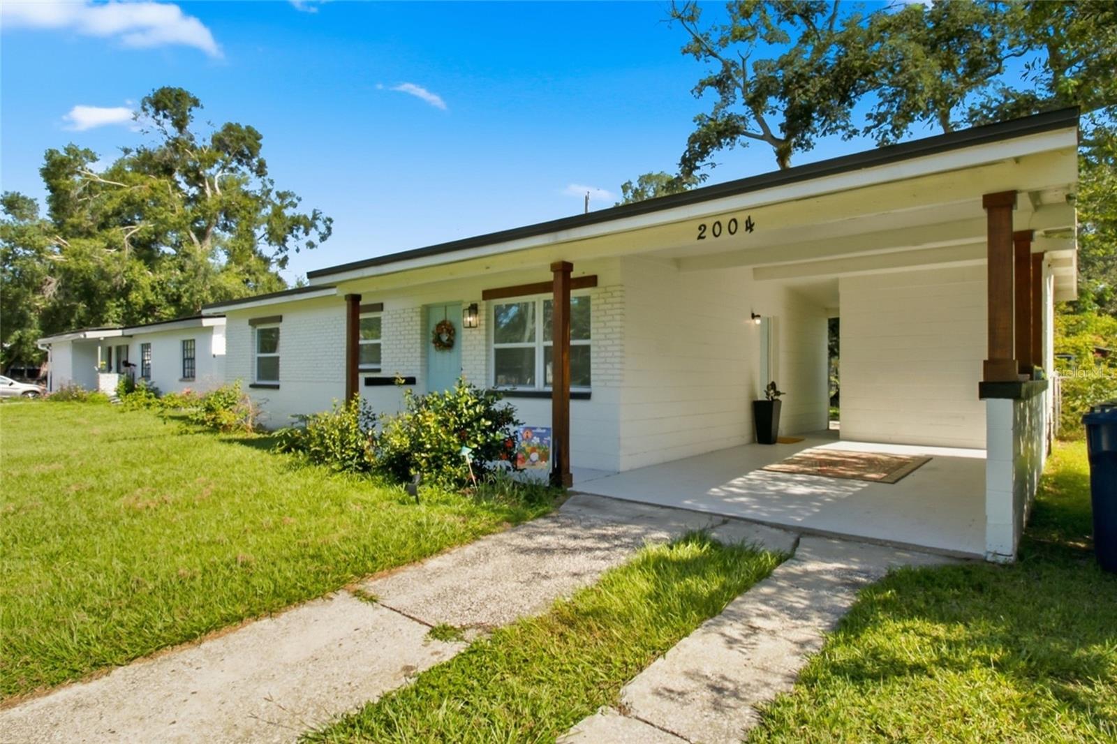 3/2 Fully renovated ranch-style home tucked away in a peaceful corner of NE Seminole Heights and located in an Accessory Dwelling Unit (ADU) City of Tampa designated district! That means you could potentially add a detached living space for multigenerational living! 
Walk to the Hillsborough River, a Frisbee Golf park and green space only 2 blocks away. You're also a short distance from the popular Corner Club known for live music and all the eats. Enjoy all of the local parks dotted along the river's shore or visit the many Little Libraries located throughout the neighborhood. This home is special. it was stripped down to the studs 3 years ago and remodeled from the ground up! That means you can move in and enjoy your home without the worries of an older home. The roof, water heater, plumbing, electric, all stainless steel kitchen appliances and the LG Washer/Dryer Tower are all 3 years or less old! Newer appliances also mean water and electric bill savings every month! As soon as you walk in, you'll notice the open concept 8x8 ft kitchen and 10x8 ft living room combo so you can prepare your favorite meals and still hold conversations with guests or catch up on your shows. The all-wood cabinets are tastefully combined with black and white mottled marble counter tops. This eat-in kitchen has plenty of space for a dining room set or island. And wait until you see the Owner's Suite! It is 12x12 square feet plus has a beautiful subway tiled shower combined with Mediterranean-inspired flooring in the ensuite, and a walk-in closet with an attractive and functional storage system. The two remaining bedrooms each conveniently contain similar storage systems and easy-care flooring. A second, modern bathroom contains a lovely blue vessel sink and the traditional subway tile and blue and white Mediterranean-inspired tile in the shower. Easy-care, wood-look laminate and decorative ceramic tile and a unique accent wall round out this lovely home. Moving to the outside, you'll be happy to see the carport to protect your vehicle from the Florida sun and stay dry during rainy days. Next is the attached laundry room with a wifi enabled LG Washer Dryer Tower, water-proof hexagonal vinyl tiles and extra storage. Last stop to your backyard where you'll find a mature tree, home to local songbirds, casting welcome shade over the yard and back patio. There's room to grill, for a gazebo or for quiet reading or contemplation. You'll also find native and tropical plants attracting local pollinators. We're not done...There is a 2-year old shed for your yard care, camping or recreational toys. Right next to that, a fire pit is perfect for those cool Florida nights. Hard to imagine during the summer months, but I promise they're coming! 
Make time for a private showing and begin life in this easy-care, efficient home in one of Tampa's friendliest neighborhoods!