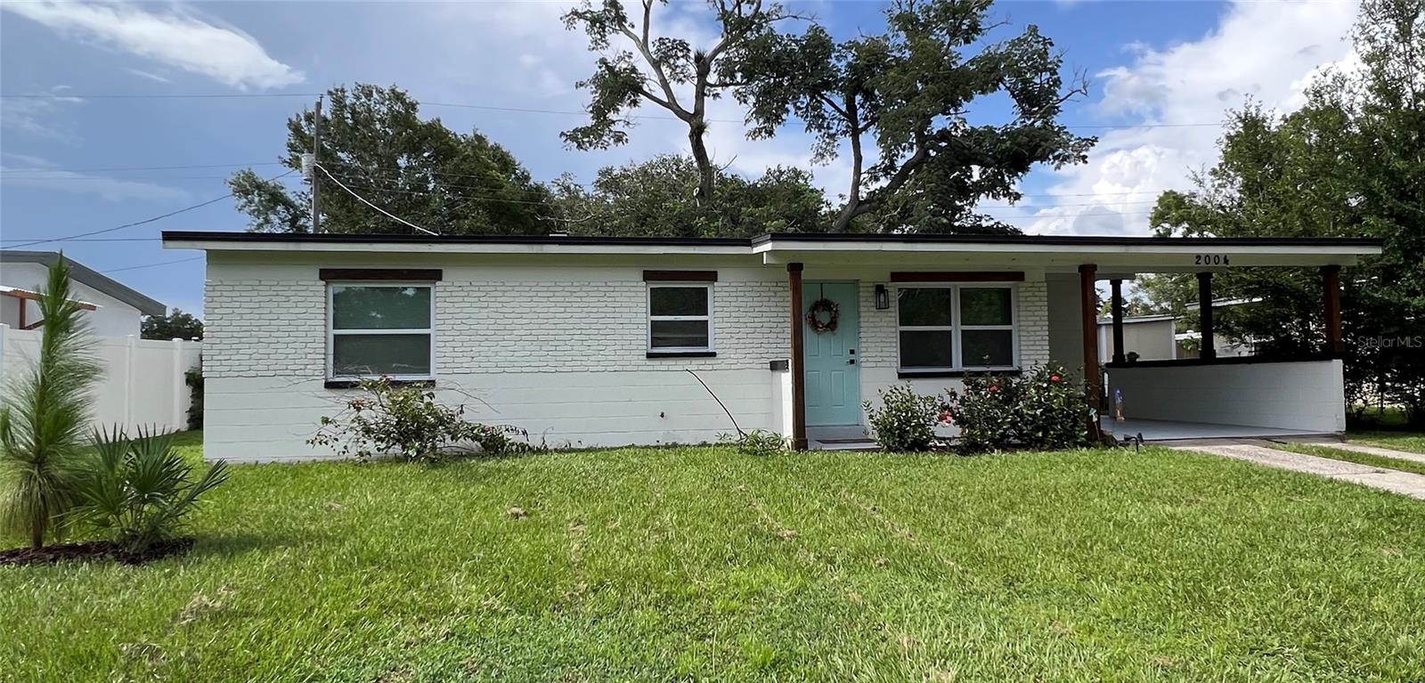 3/2 Fully renovated ranch-style home tucked away in a peaceful corner of NE Seminole Heights. Walk to the Hillsborough River,  a Frisbee Golf park and green spade only 2 blocks away. Enjoy all of the local parks dotted along the river's shore or visit the many Little Libraries located throughout the neighborhood. This home is special. it was stripped down to the studs 3 years ago and remodeled from the ground up! That means you can move in and enjoy your home without the worries of an older home. The roof, water heater, plumbing, electric, all stainless steel kitchen appliances and the LG Washer/Dryer Tower are all 3 years or less old! Newer appliances also mean water and electric bill savings every month! As soon as you walk in, you'll notice the open concept 8x8 ft kitchen and 10x8 ft living room combo so you can prepare your favorite meals and still hold conversations with guests or catch up on your shows. The all-wood cabinets are tastefully combined with black and white mottled marble counter tops. This eat-in kitchen has plenty of space for a dining room set or island. And wait until you see the Owner's Suite! It is 12x12 square feet plus a beautiful subway tiled shower combined with Mediterranean-inspired flooring in the ensuite, and a walk-in closet with an attractive and functional storage system. The two remaining bedrooms each conveniently contain similar storage systems. A second, modern bathroom contains a lovely blue vessel sink and the traditional subway and blue and white Mediterranean-inspired tile in the shower. Easy-care, wood-look laminate and decorative ceramic tile and a unique accent wall round out this lovely home. Moving to the outside, you'll be happy to see the carport to protect your vehicle from the Florida sun and stay dry during rainy days. Next is the attached laundry room with a wifi enabled LG Washer Dryer Tower, water-proof hexagonal vinyl tiles and extra storage. Last stop to your backyard where you'll find a mature tree, home to local songbirds which casts welcome shade over the yard and back patio. There's room to grill, for a gazebo or for quiet reading or contemplation. You'll also find native and tropical plants attracting local pollinators. We're not done...There is a 2-year old shed for your yard care, camping or recreational toys. Right next to that, a fire pit is perfect for those cool Florida nights. Hard to imagine during the summer months, but I promise they're coming! 
Make time for a private showing and begin life in this easy-care, efficient home in one of Tampa's friendliest neighborhoods!