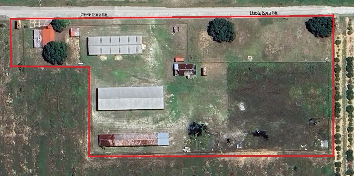 The property at 321 Davis Brothers Road in Frostproof, Florida, encompasses
approximately 4.7 +/- acres. It features a 1,600-square-foot office equipped with two half
bathrooms, a 7,500-square-foot pole barn, a 4,000-square-foot pole barn, a 5,000-
square-foot warehouse, and a 1,200-square-foot warehouse. The compound is secured by
a chain-link fence and is supplied with water from both a 4-inch well and a 12-inch well. 3
phase power, telephone and cable are at the site. The property's strategic location near
major industrial facilities, including those owned by Lowe's and Ferguson, suggests a
potential for commercial or industrial use. Currently zoned agricultural but can be
changed to Industrial Zoning. Property is within an opportunity zone. Parcel is currently
14.5 acres. Only 4.7 +/- acres offered and will be resurveyed prior to closing. Property taxes
are approximate.